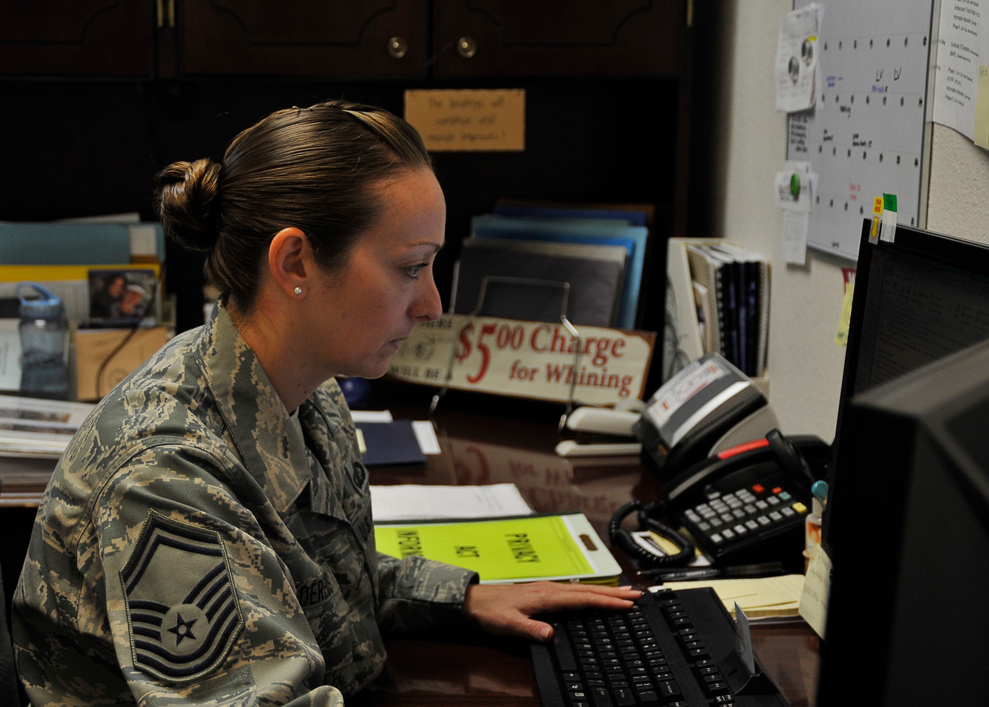 Senior Master Sgt. April Dereus, 325th Comptroller Squadron superintendent, checks emails April 18 to see where she is needed for the day. A superintendent is responsible for coordinating mission cohesion on many levels. (U.S. Air Force photo by Airman 1st Class Solomon Cook)