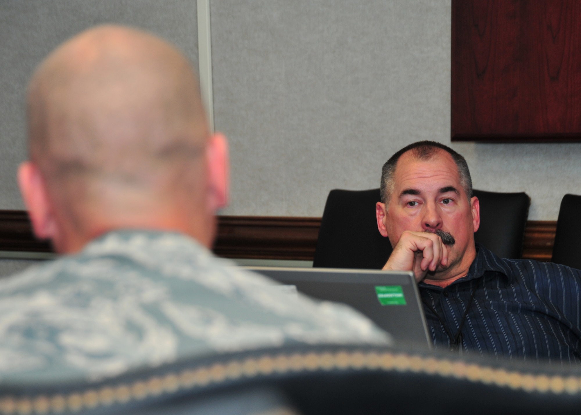 John Denn, Headquarters Air Force Security Forces Center deputy chief of integrated defense, listens to Senior Master Sgt. Ryan Sprauer, Air Force vulnerability assessment team manager, and his ideas to improve Tyndall’s vulnerabilities April 23 at the 325th Comptrollers Squadron conference room. The HQ AFSFC conducts vulnerability assessments on approximately 20 Air Force installations annually. (U.S. Air Force photo by Airman 1st Class Sergio A. Gamboa)