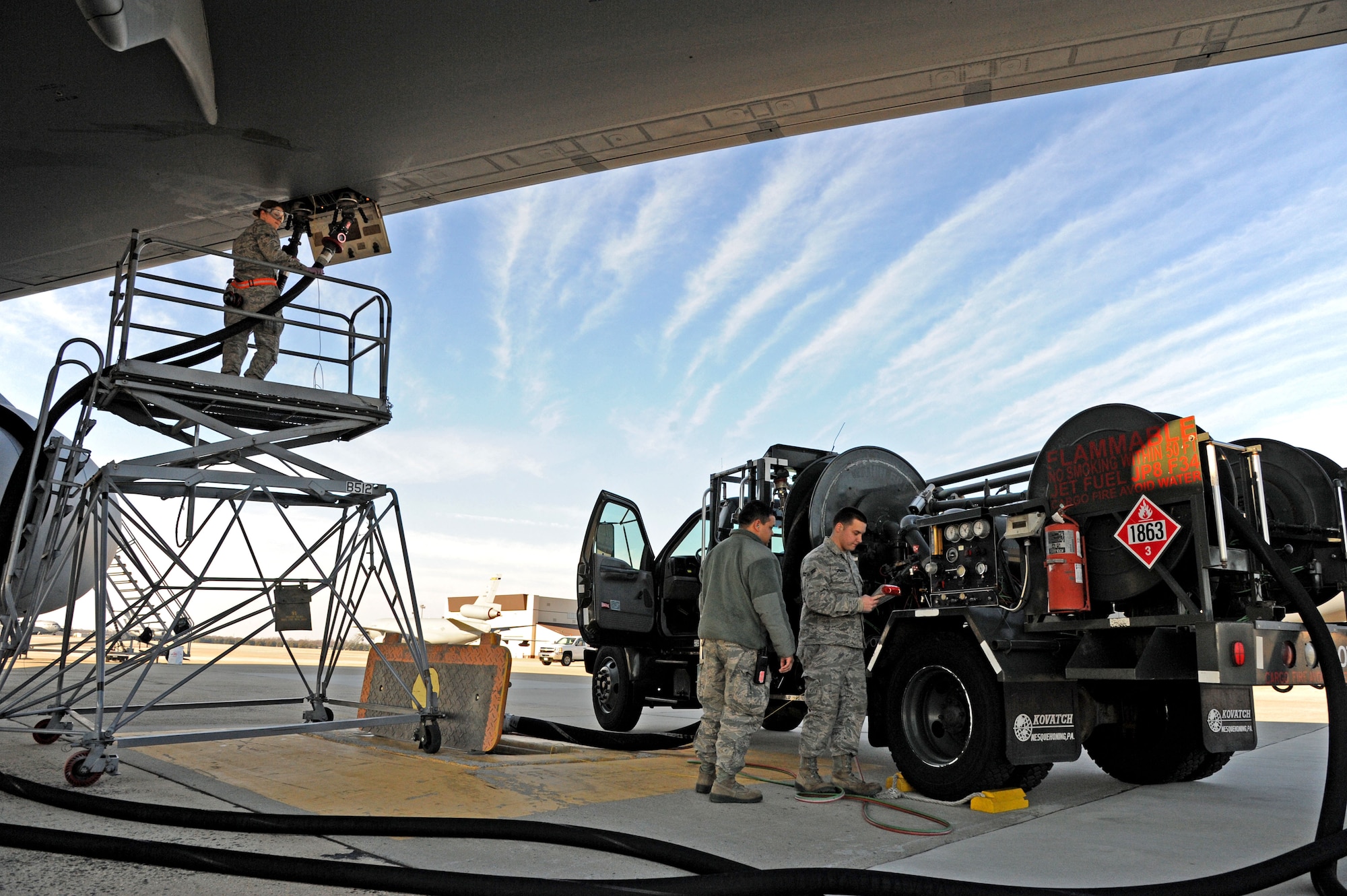 Members of the 87th Logistics Readiness Squadron Fuels anagement Flight utilize a fuel hydrant at McGuire Field to fulfill a fuel order Jan. 17, 2014, at Joint Base McGuire-Dix-Lakehurst, N.J. 87th LRS FMF provides jet fuel, gasoline and heating lamp oil to the entire joint base. (U.S. Air Force photo by Airman 1st Class sean M. Crowe/Released)