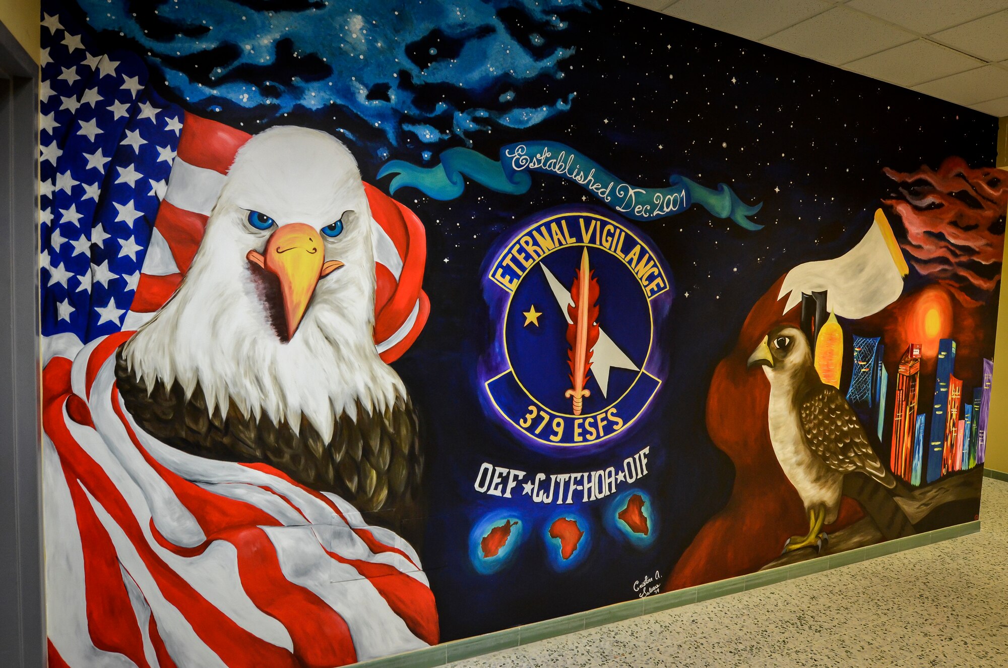Airman 1st Class Cristina Salinas painted this mural inside the 379th Expeditionary Security Forces Squadron. Salinas is a defender with the 379th ESFS and hails from Three Rivers, Texas and is deployed from Hurlburt Field, Fla. (U.S. Air Force photo/Senior Airman Jared Trimarchi)