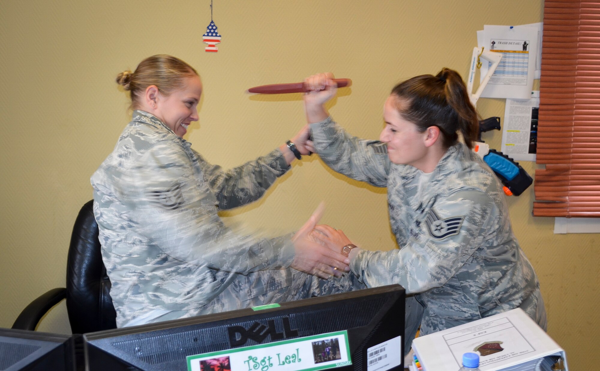 Tech. Sgt. Amanda Leal fights off Staff Sgt. Angel Logan during an insider threat exercise at Al Udeid Air Base, Qatar, April 24, 2014. After numerous insider attacks on service members on military installations, the U.S. Air Forces Central Command area of responsibility implemented the Check Six program to instill a self-defense culture where all Airmen are trained and mentally prepared to react to any act of violence.  The program was part of Check Six training to ensure Airmen remain vigilant. Leal and Logan are assigned to the 379th Expeditionary Civil Engineering Squadron. (U.S. Air Force photo/Tech. Sgt. Trevor Pedro) 