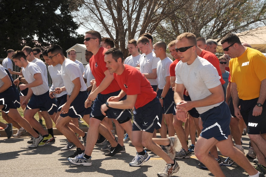 VANCE AIR FORCE BASE, Okla. -- Airmen begin the 5th Annual Sexual Assault Prevention Response Awareness Run 5k April 18 outside the Fitness Center. Approximately 400 Team Vance members participated in the run. For the past five years the Sexual Assault Response Coordinator office teamed up with the Health and Wellness Center to set up a course outlined by cones to direct runners and provide water. The purpose of the run is to give Airmen time to reflect on the impact sexual assault has on the victims, their families, their units and the Air Force. (U.S. Air Force photo/Senior Airman Frank Casciotta) 