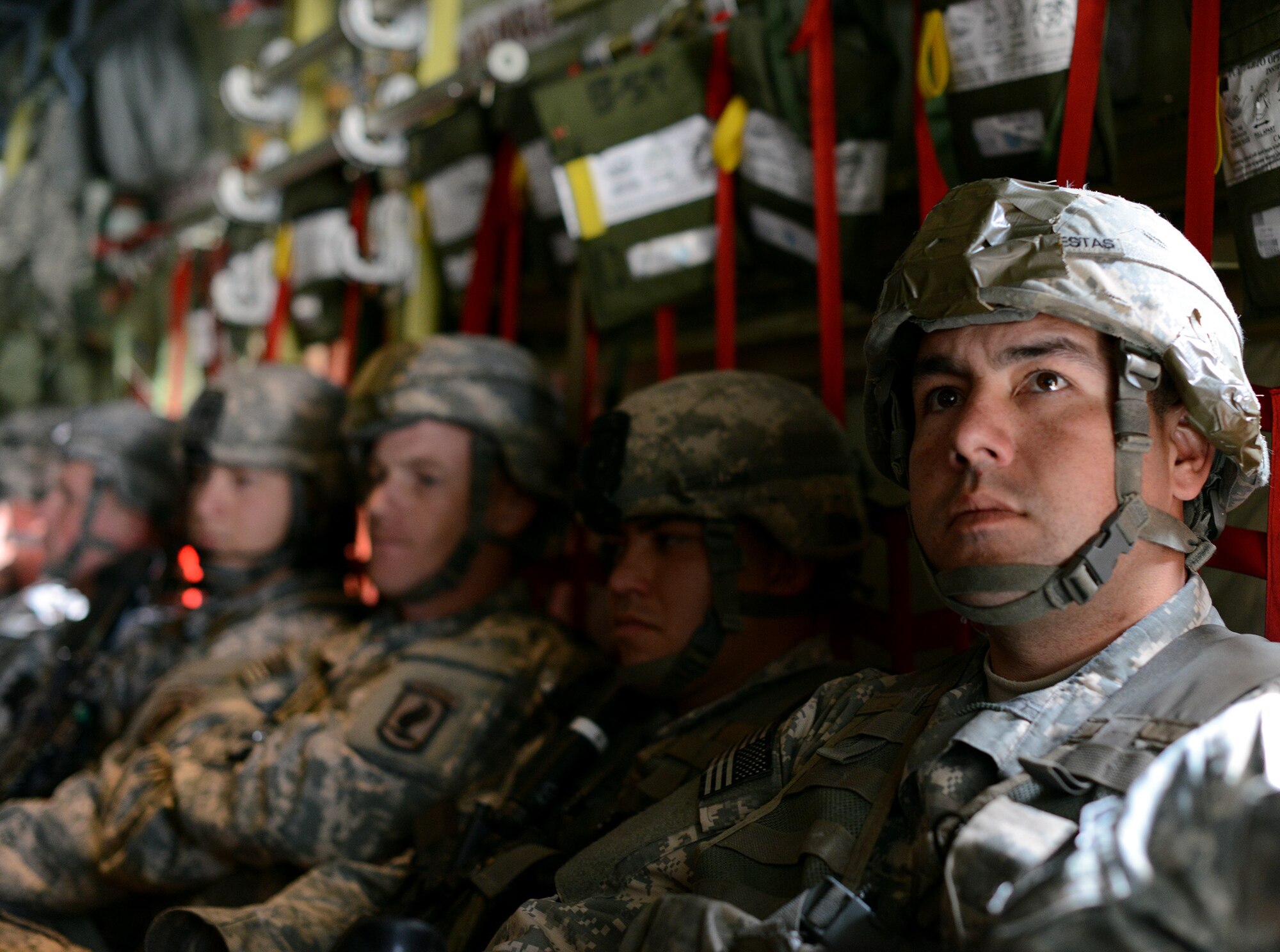 An Army paratrooper waits onboard a U.S. Air Force C-130 Super Hercules prior to taking off from Aviano Air Base April 24, 2014. Approximately 150 U.S. Army Soldiers from the 173rd Infantry Brigade Combat Team from Vicenza, Italy, will conduct joint NATO training, a first in a series of expanded U.S. land force training activities in Poland and the Baltic region scheduled for the next few months. (U.S. Air Force photo/Staff Sgt. R.J. Biermann)