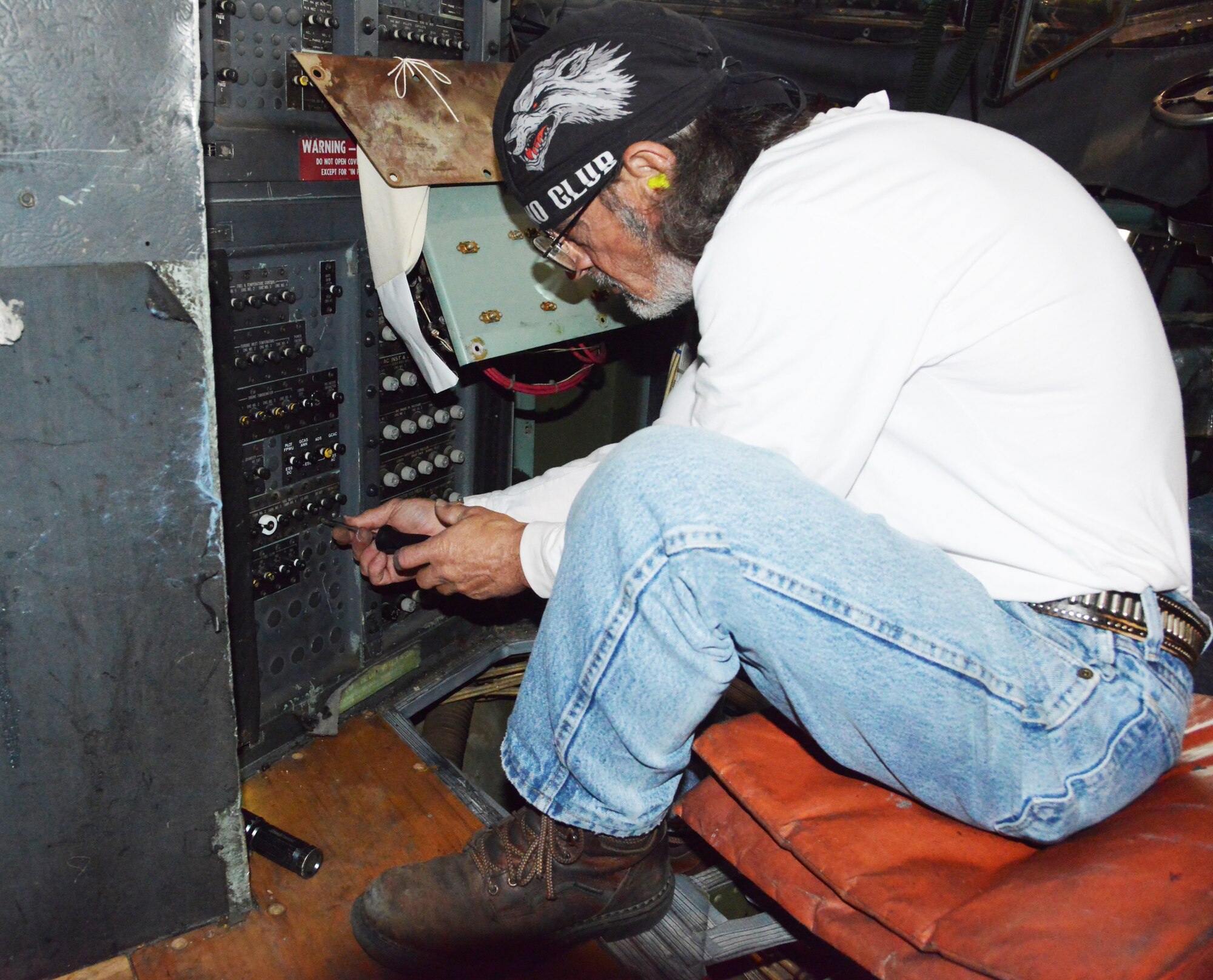 Rusty Painter, 560th Aircraft Maintenance Squadron aircraft electrician, cleans corrosion from a circuit breaker faceplate to ensure aircrews are able to read it when needed. (U.S. Air Force photo by Ray Crayton)