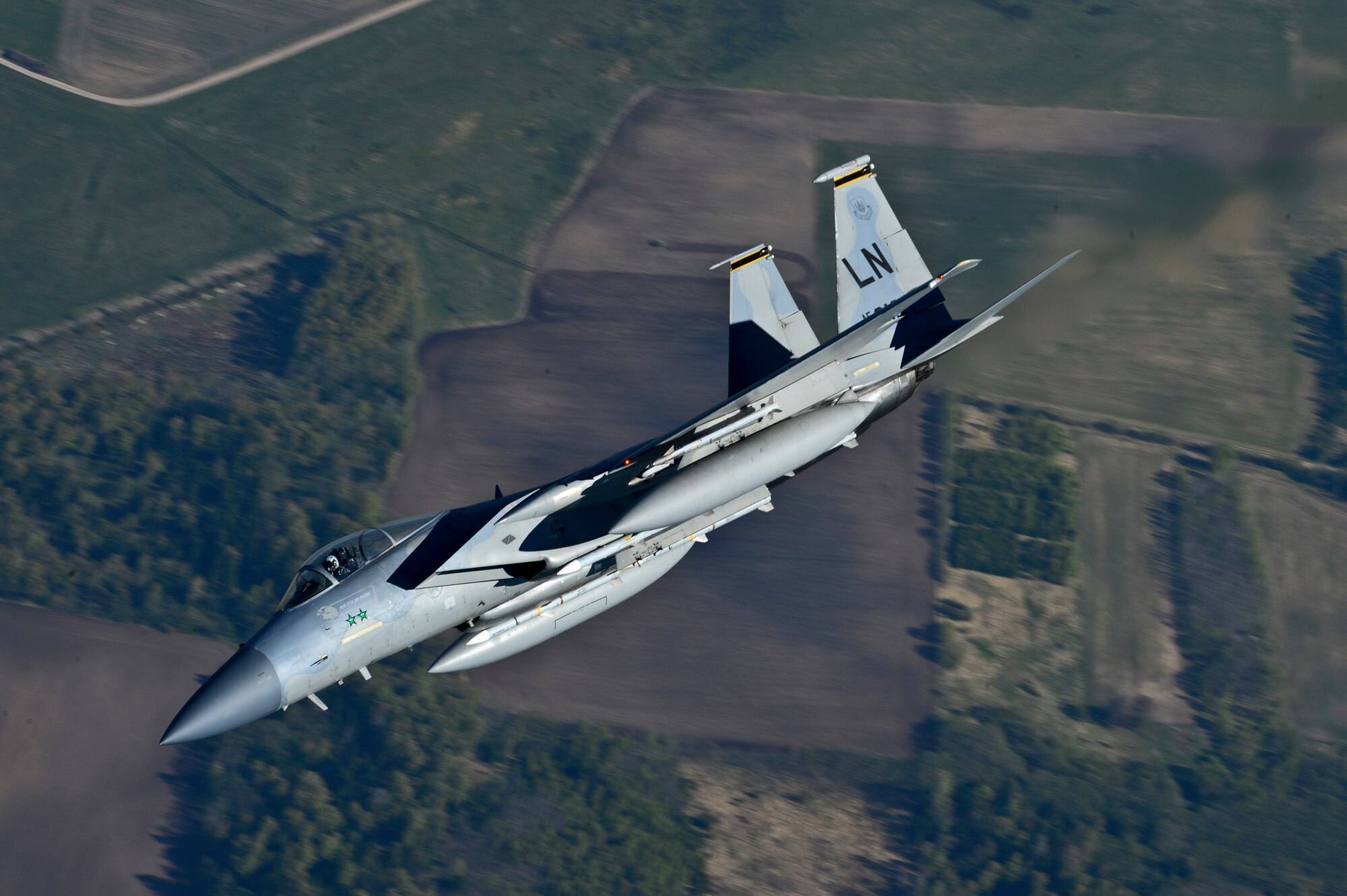 Maj. Barak Amundson, 493rd Expeditionary Fighter Squadron pilot, flies over Lithuania during a training mission with the Lithuanian air force April 23, 2014. The 48th Air Expeditionary Group has been conducting the Baltic Air Policing mission here since January and will be handing over the mission to the Polish air force at the beginning of May. (U.S. Air Force photo by Airman 1st Class Dana J. Butler/Released)