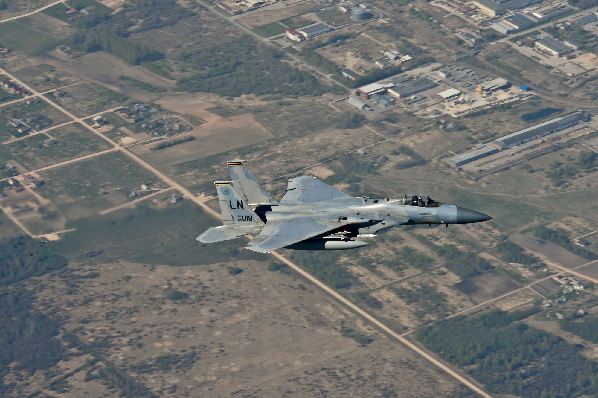 Maj. Barak Amundson, 493rd Expeditionary Fighter Squadron pilot, flies over Lithuania during a training mission with the Lithuanian air force April 23, 2014. The 48th Air Expeditionary Group has been conducting the Baltic Air Policing mission here since January and will be handing over the mission to the Polish air force at the beginning of May. (U.S. Air Force photo by Airman 1st Class Dana J. Butler/Released)