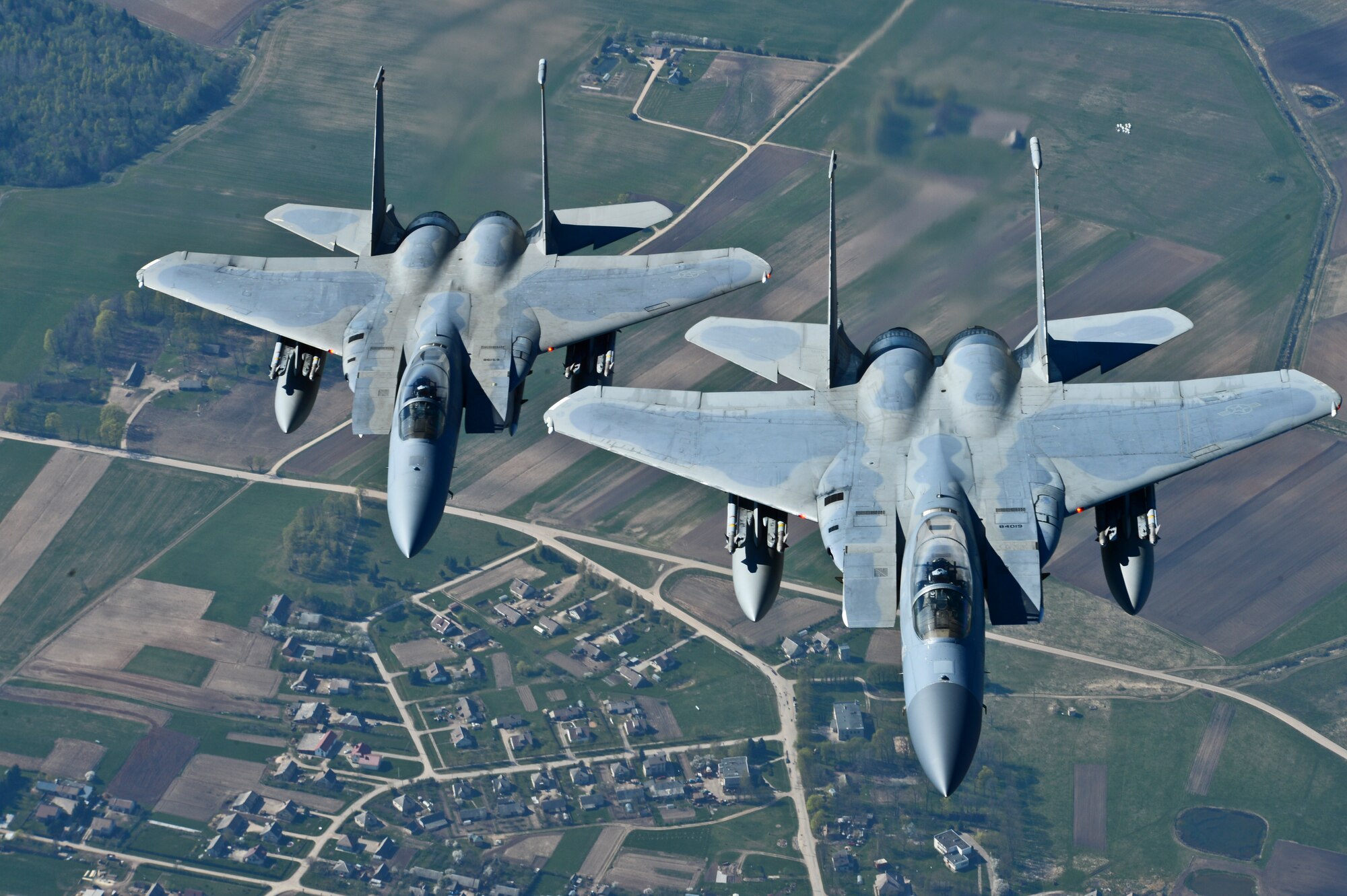 Maj. Barak Amundson and 1st Lt. Matthew Scott, 493rd Expeditionary Fighter Squadron pilots, fly over Lithuania during a training mission with the Lithuanian air force April 23, 2014. The 48th Air Expeditionary Group has been conducting the Baltic Air Policing mission here since January and will be handing over the mission to the Polish air force at the beginning of May. (U.S. Air Force photo by Airman 1st Class Dana J. Butler/Released)