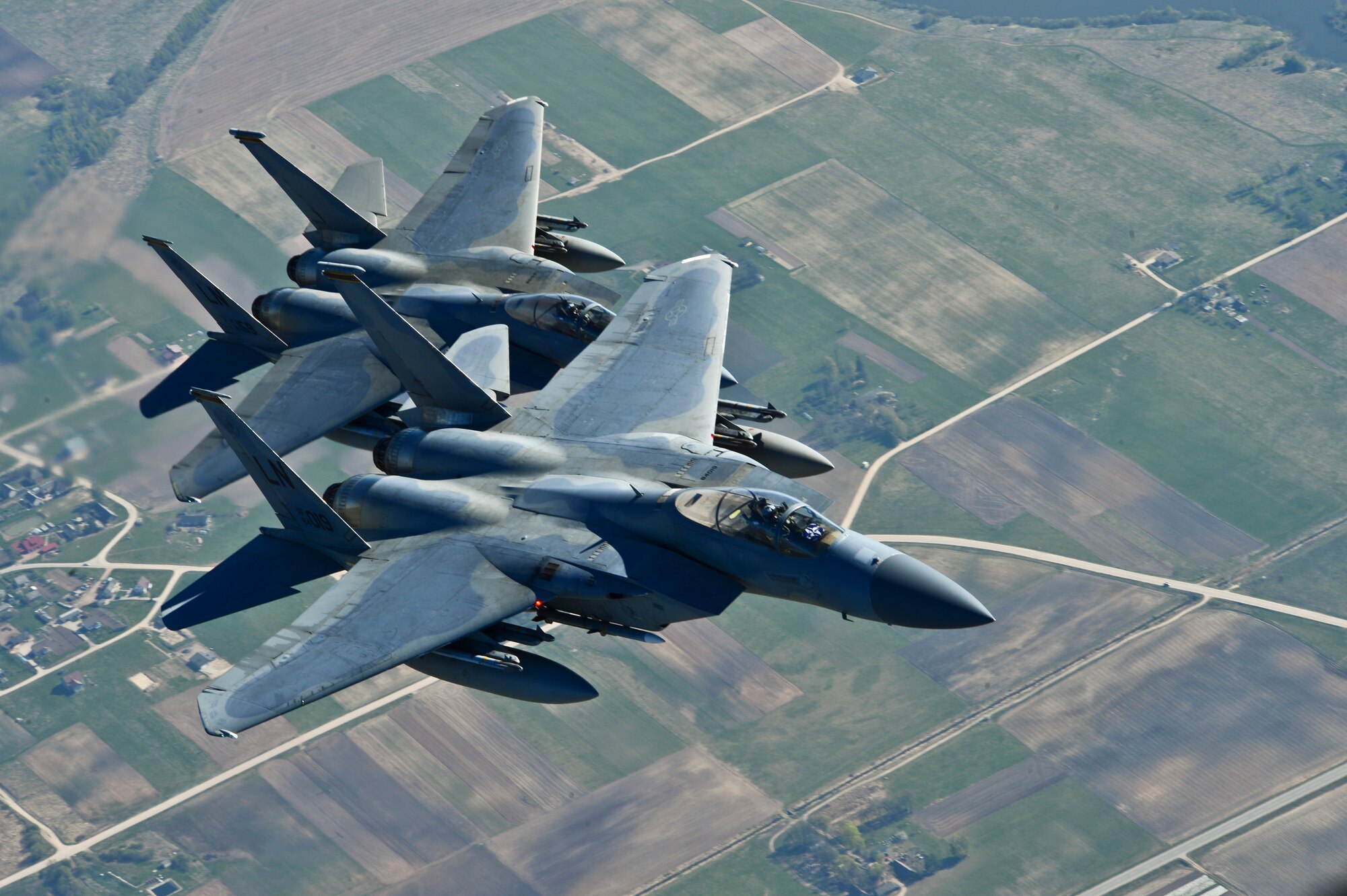 Maj. Barak Amundson and 1st Lt. Matthew Scott, 493rd Expeditionary Fighter Squadron pilots, fly over Lithuania during a training mission with the Lithuanian air force April 23, 2014. The 48th Air Expeditionary Group has been conducting the Baltic Air Policing mission here since January and will be handing over the mission to the Polish air force at the beginning of May. (U.S. Air Force photo by Airman 1st Class Dana J. Butler/Released)