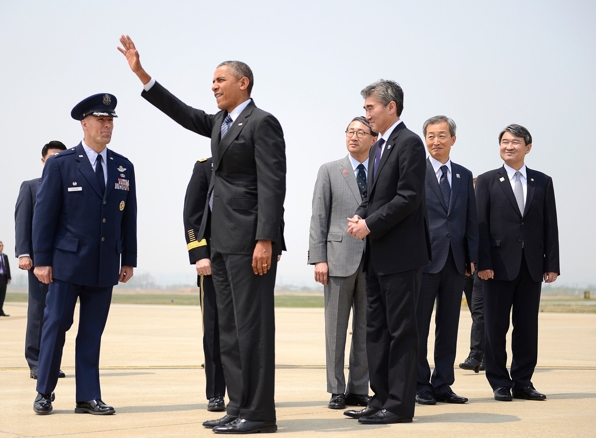 President Barack Obama greets military and civilian members upon his arrival to Osan Air Base, Republic of Korea, April 25, 2014.   Obama is the third President to visit Osan AB and this marks his fifth trip to Asia as he focuses on the Asia-Pacific region and rebalancing the world's largest emerging region.  (U.S. Air Force photo/Tech. Sgt. Micky M. Bazaldua)
