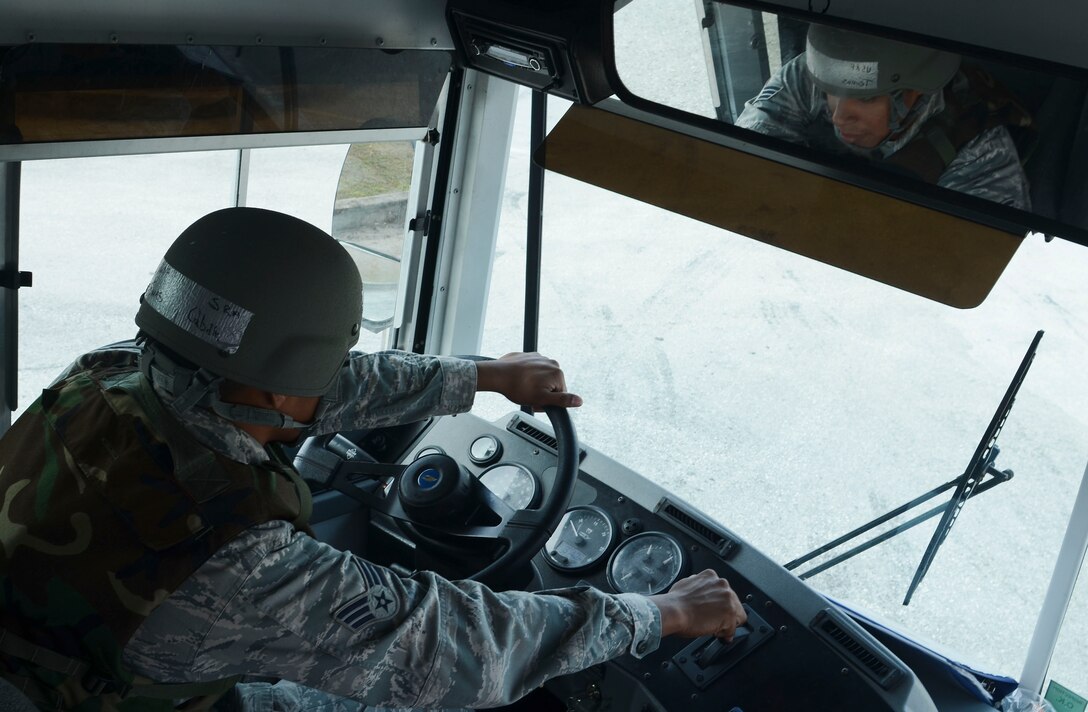 734th Air Mobility Squadron passenger service agent Senior Airman Tomas Cubilla operates a passenger bus April 16, 2014, during an operational readiness exercise on Andersen Air Force Base, Guam. The 36th Wing exercises regularly to ensure Airmen and the base populace are trained and ready to respond quickly and accurately in the event of a crisis. (U.S. Air Force photo by Airman 1st Class Emily A. Bradley/Released)