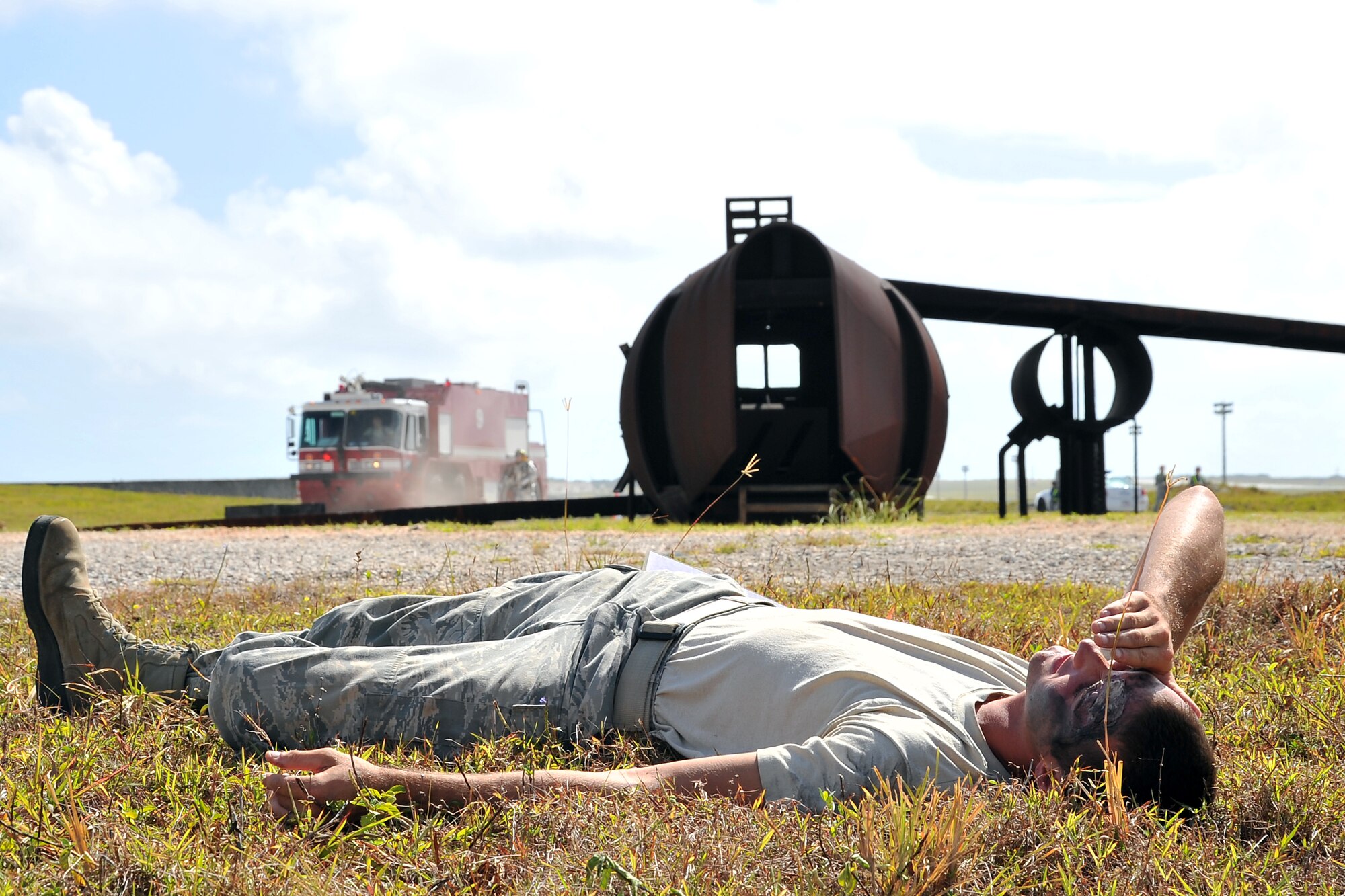 36th Civil Engineers Squadron Fire and Emergency Services firefighters respond to a simulated aircraft crash and mass casualty scenario during an operational readiness exercise on Andersen Air Force Base, Guam, April 14, 2014. The 36th Wing exercises regularly to ensure Airmen and the base populace are trained and ready to respond quickly and accurately in the event of a crisis. (U.S. Air Force photo by Staff Sgt. Melissa B. White/Released)
