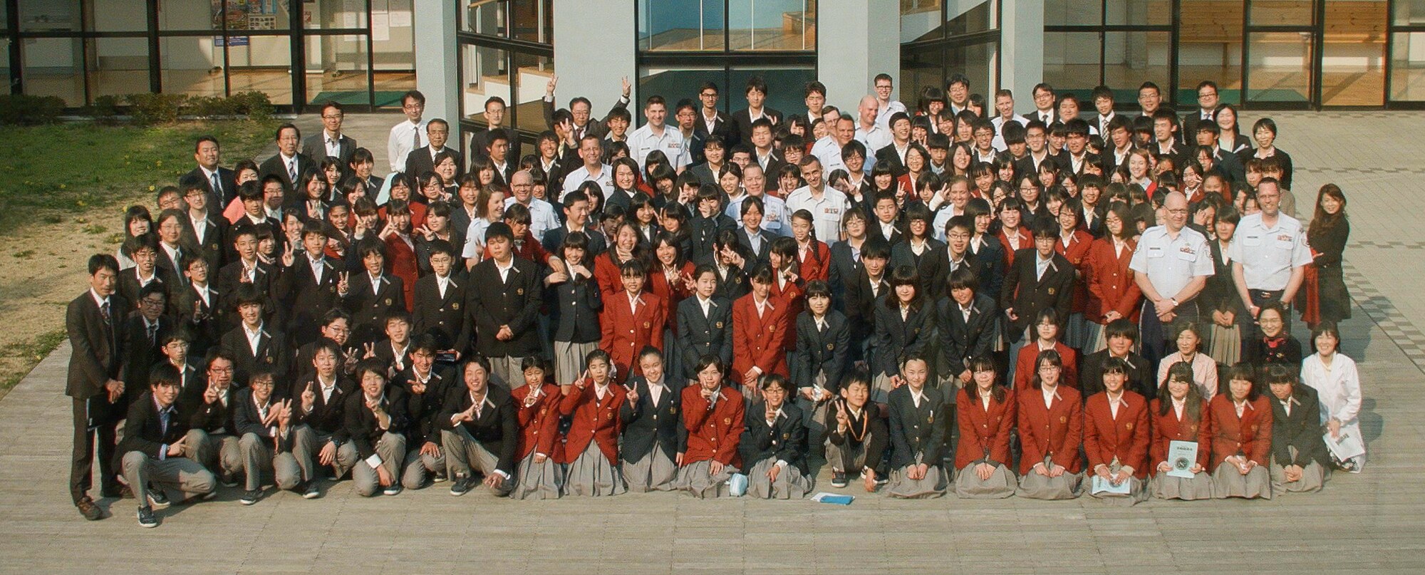 IBARAKI, Japan—Members of Pacific Showcase, Band of the Pacific-Asia jazz ensemble, pose for a group photo along with teachers and students at Chigakukan Secondary School in Mito City, Ibaraki, Japan, April 16, 2014. The two-part event included a live concert and an interactive group activity involving two-way communication between the students and Air Force Band members. (U.S. Air Force photo by Staff Sgt. Geoffrey Fisher)
