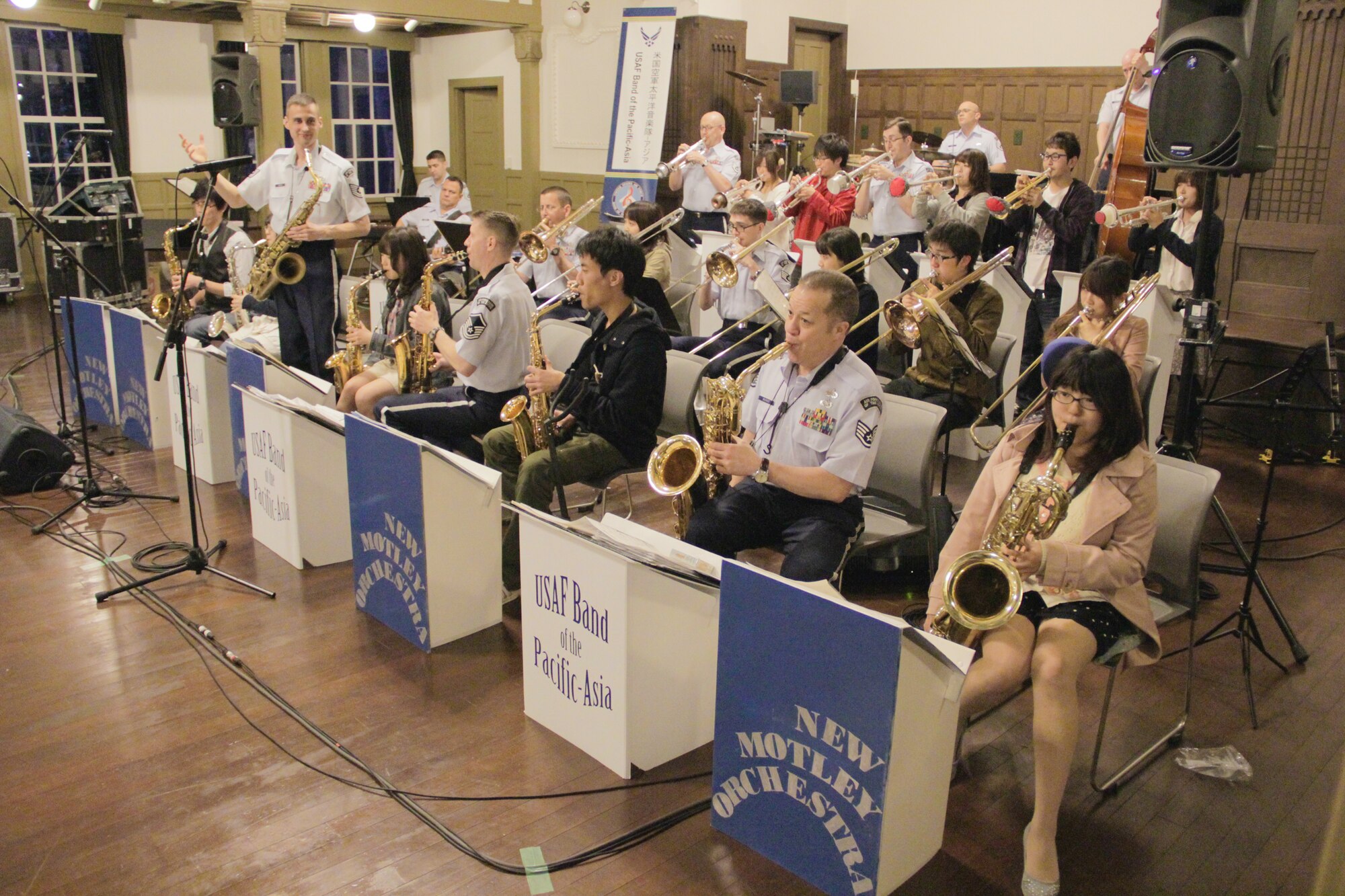 TOCHIGI, Japan—Pacific Showcase, Band of the Pacific-Asia jazz ensemble, performs “Put It Right Here” in a joint concert with the “New Motley Orchestra” at Utsunomiya University, Utsunomiya City, Tochigi, Japan, April 14, 2014. The mini-concert was part of an evening performance and cultural exchange with students at the university. (U.S. Air Force photo by Staff Sgt. Geoffrey Fisher)