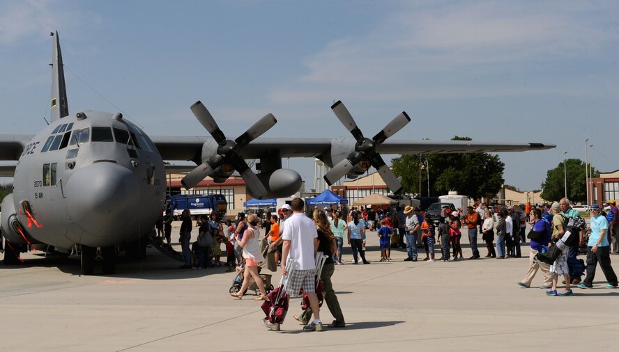 Spectators wait in line to enter a C-130 Hercules during the Defenders of Liberty Air Show on Barksdale Air Force Base, La., April 26, 2014. The C-130H primarily performs the tactical portion of the airlift mission. The aircraft is capable of operating from rough, dirt strips and is the prime transport for airdropping troops and equipment into hostile areas. (U.S. Air Force photo/Senior Airman Benjamin Gonsier)
