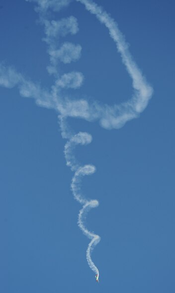 An Extra 300SHP, piloted by Kevin Coleman, performs an aerial maneuver during the Defenders of Liberty Air Show on Barksdale Air Force Base, La., April 25, 2014. Coleman is one of the youngest air show celebrities in the world, at the age of 21, and is a second generation air show performer. (U.S. Air Force photo/Senior Airman Benjamin Gonsier)