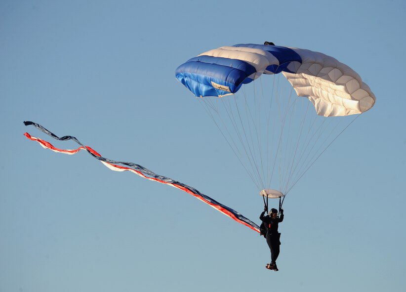 A U.S. Air Force Sky Diving Team jumper parachutes to the ground during the Defenders of Liberty Air Show on Barksdale Air Force Base, La., April 25, 2014. The sky diving team, known as the Wings of Blue, makes roughly 19,000 jumps per year for AM490, the basic free fall course, and training, which results in approximately 700 jump wings being awarded annually. (U.S. Air Force photo/Senior Airman Benjamin Gonsier)