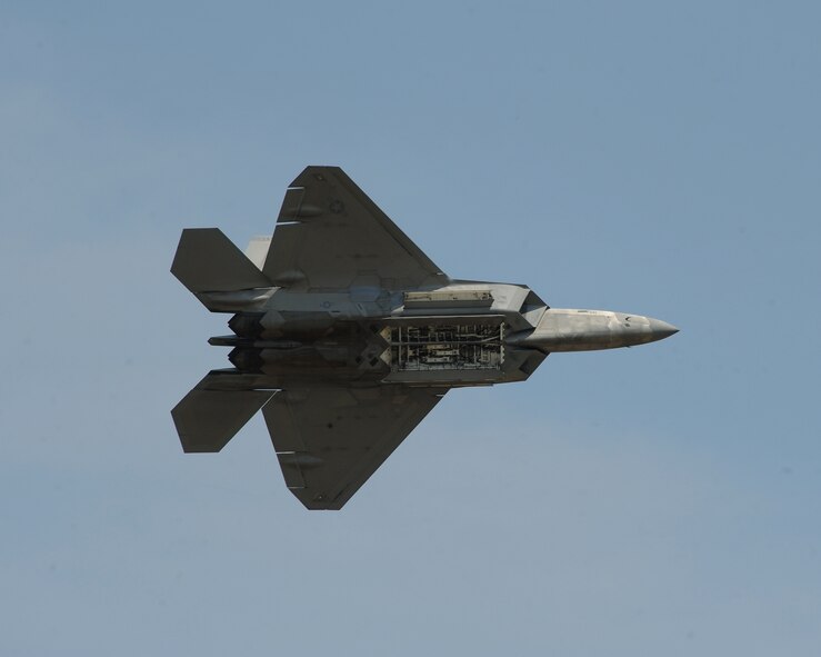 An F-22 Raptor opens its weapons bay during the Defenders of Liberty Air Show on Barksdale Air Force Base, La., April 26, 2014. The Raptor performs both air-to-air and air-to-ground missions allowing full realization of operational concepts vital to the 21st century Air Force. (U.S. Air Force photo/Senior Airman Benjamin Gonsier)