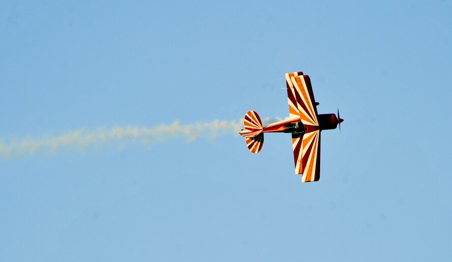 Maj. Jeremy Holt performs biplane acrobatics during the Defenders of Liberty Air Show on Barksdale Air Force Base, La., April 25, 2014. Holt received his tail-wheel training in a decathlon and started working on basic acrobatics with his squadron commander. (U.S. Air Force photo/Airman 1st Class Benjamin Raughton)