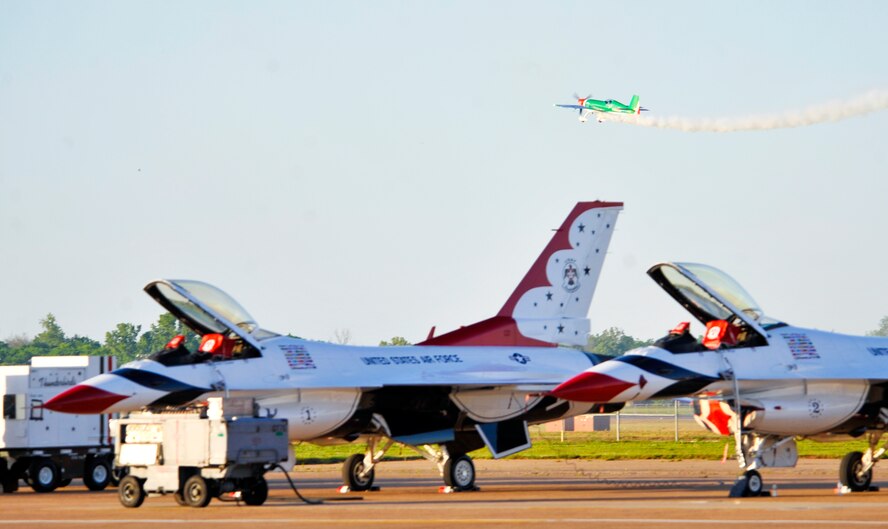 An Extra 300SHP, piloted by Kevin Coleman, performs an aerial maneuver during the Defenders of Liberty Air Show on Barksdale Air Force Base, La., April 25, 2014. Coleman is one of the youngest air show celebrities in the world, at the age of 21, and is a second generation air show performer. (U.S. Air Force photo/Airman 1st Class Benjamin Raughton)