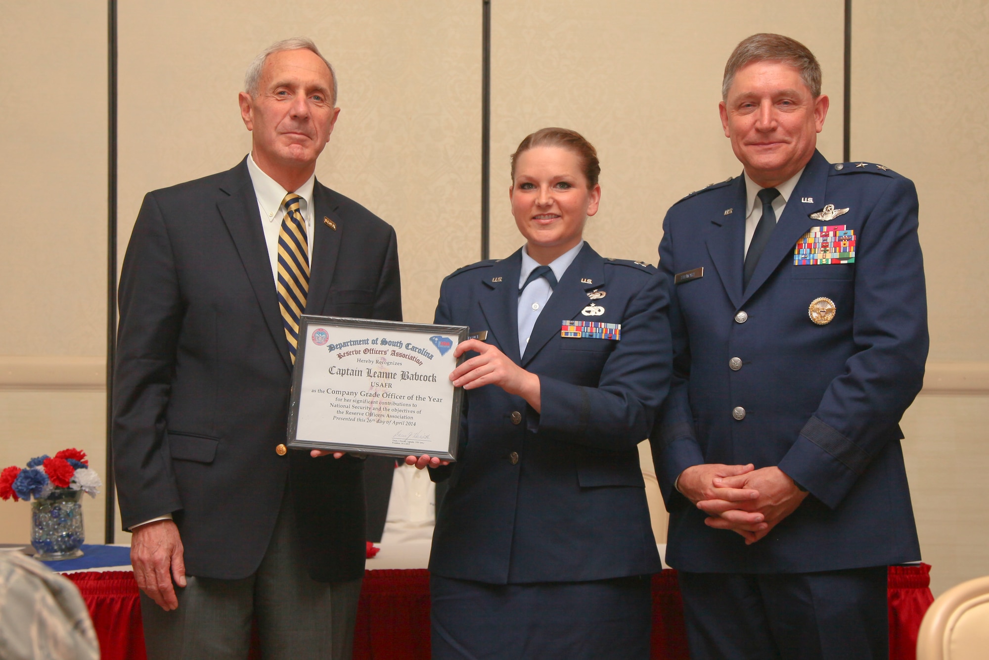 Capt. Leanne Babcock, a 38th Aerial Port Squadron logisitics readiness officer and ROA company grade officer of the year recipient, poses for a photo yesterday at the base club here at Joint Base Charleston, S.C. The ROA awards luncheon recognized the accomplishments of various South Carolina reserve organizations and ROA members. (U.S. Air Force photo by Staff Sgt. Rashard Coaxum/released)