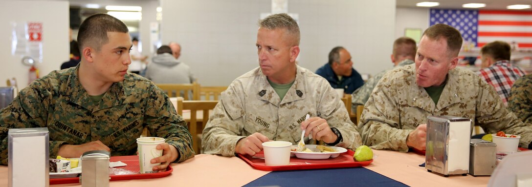 Lance Cpl. Christian Quintanar, an administrative specialist with Black Sea Rotational Force 14 from 3rd Battalion, 8th Marine Regiment, speaks with Sgt. Maj. George Young, the sergeant major of 2nd Marine Logistics Group, and Brig. Gen. Edward Banta, the commanding general of 2nd MLG, during his visit to Mihail Kogalniceanu Air Base, Romania, April 26, 2014. Black Sea Rotational Force 14 is a contingent of Marines and sailors tasked with maintaining positive relations with partner nations, regional stability and increasing interoperability while providing the capability for contingency response, as directed by U.S. European Command, in the Black Sea, Balkan and Caucasus regions of Eastern Europe. (Official Marine Corps photo by Lance Cpl. Scott W. Whiting, BSRF PAO/ Released)