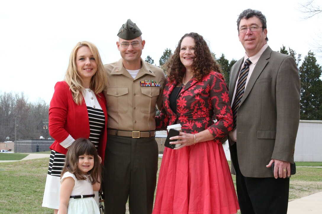 Warrant Officer Jeremy Barone stands with his family before being awarded the Bronze Star Medal with combat distinguishing device at The Basic School aboard Marine Corps Base Quantico on April 11, 2014. Barone received the award for heroic service while serving as the first sergeant with Co. F, 2nd Bn., 8th Marines, 2nd Marine Expeditionary Force Headquarters Group Forward, from April- October 2013, while deployed to Afghanistan during Operation Enduring Freedom.