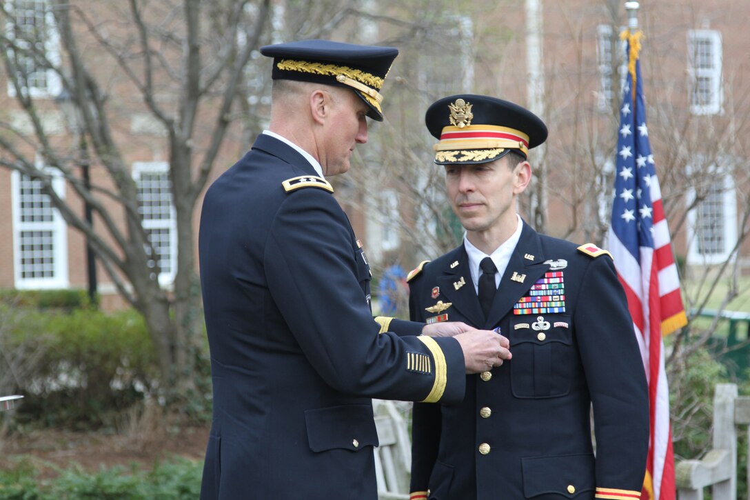 Col. Everett Spain is presented the Soldier's Medal, the U.S. Army's highest peacetime decoration for heroisim, by Maj. Gen. William Rapp, chief, Army Legislative Liaison. Spain received the award for heroism for actions taken one-year prior at the scene of the Boston Marathon bombing on April 15, 2013, where he distinguished himself following the two blasts by immediately and selflessly rushing toward the threat without regard to his own personal safety; rendering first aid until medical help arrived despite the potential for additional explosive devices.