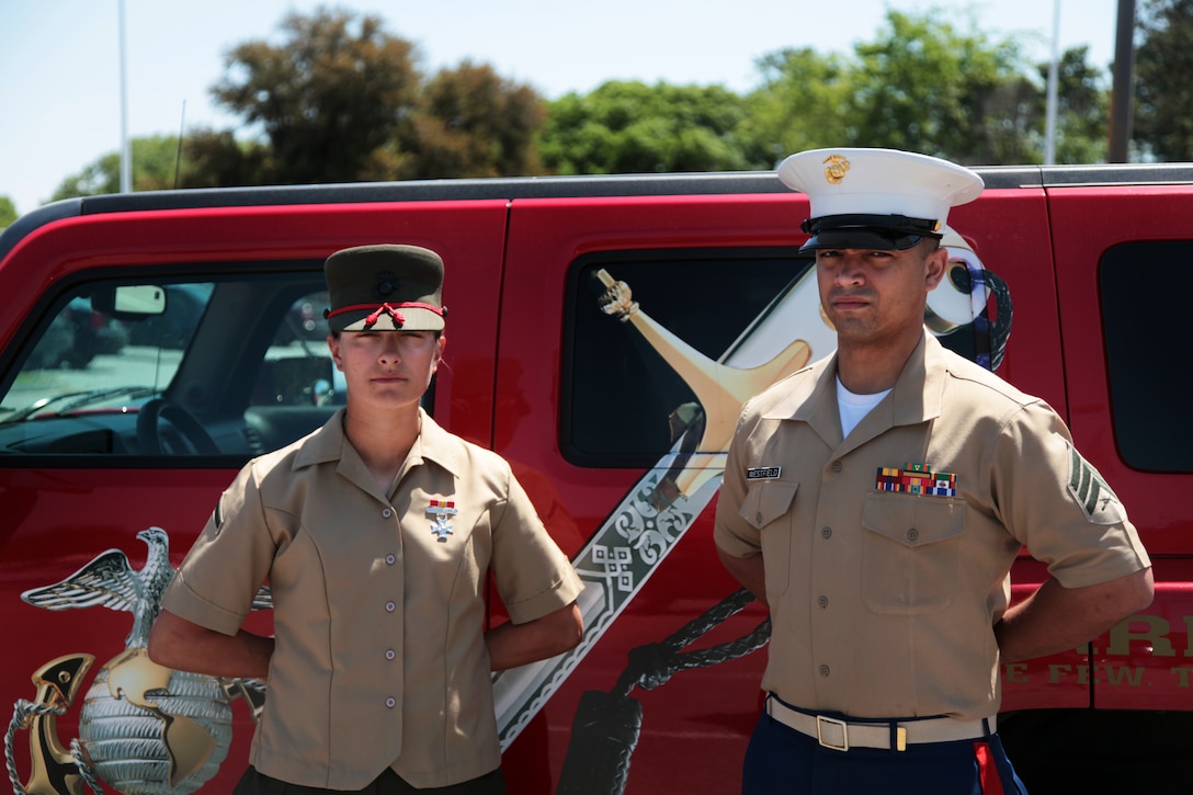 Pfc. Kendra A. Hazelwood, the Company Iron Woman from Platoon 4012, Papa Company, 4th Recruit Training Battalion, stands with Sgt. Zonell L. Westfield, her recruiter from Recruiting Station Nashville, Recruiting Sub-Station Murfreesboro, Tenn. after graduating recruit training at Marine Corps Recruit Depot Parris Island, S.C. Apr. 25. The Company Iron Man/Woman award is given to the recruit who gets the highest Physical Fitness Test and Combat Fitness Test scores in the whole company. Hazelwood scored a perfect 300 points on both the PFT and CFT. (Official Marine Corps photo by Sgt. Michael Iams)