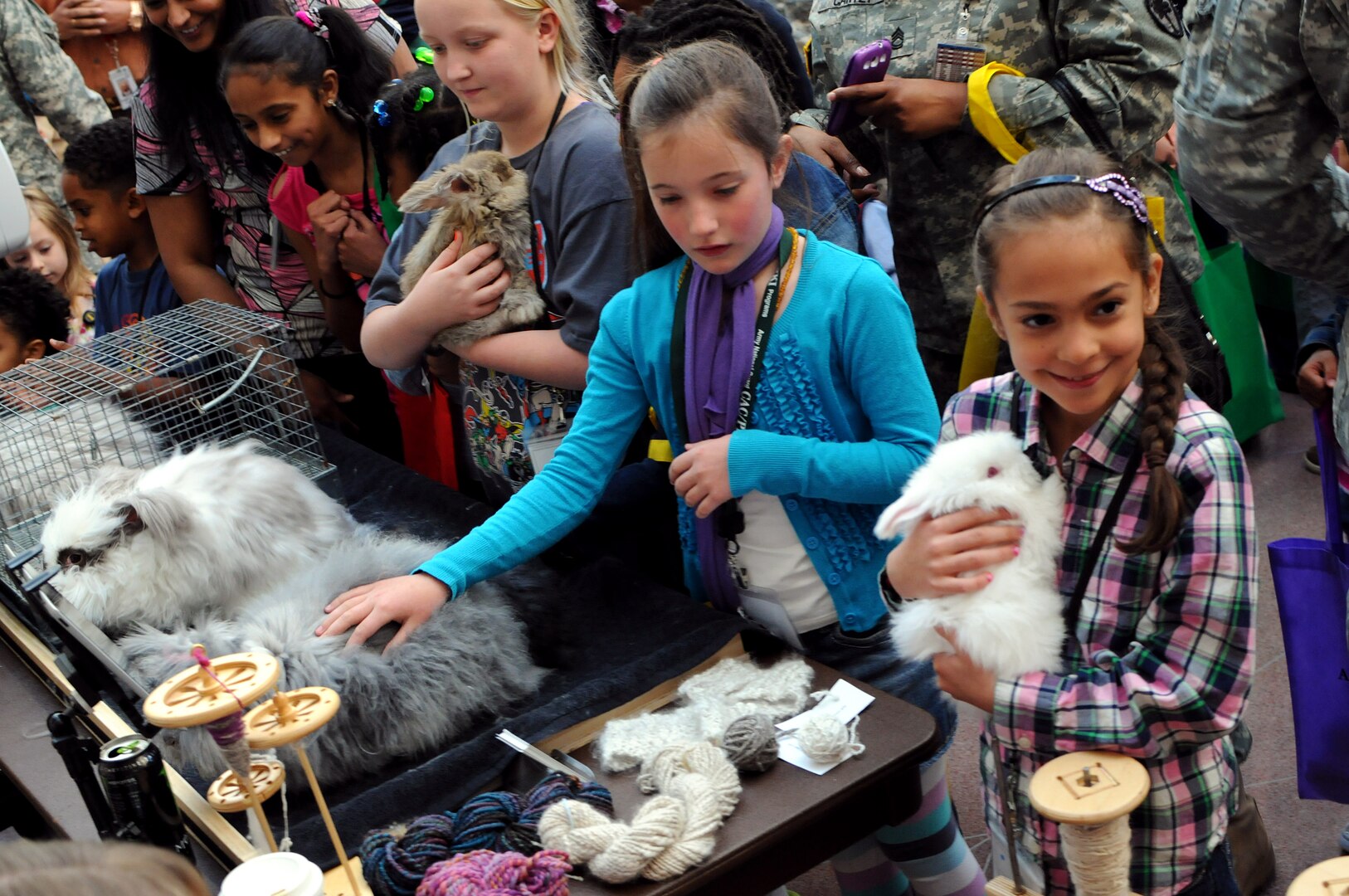 Children make new furry friends at Army National Guard's celebration of Earth Day on April 24, 2014, in Arlington, Va.