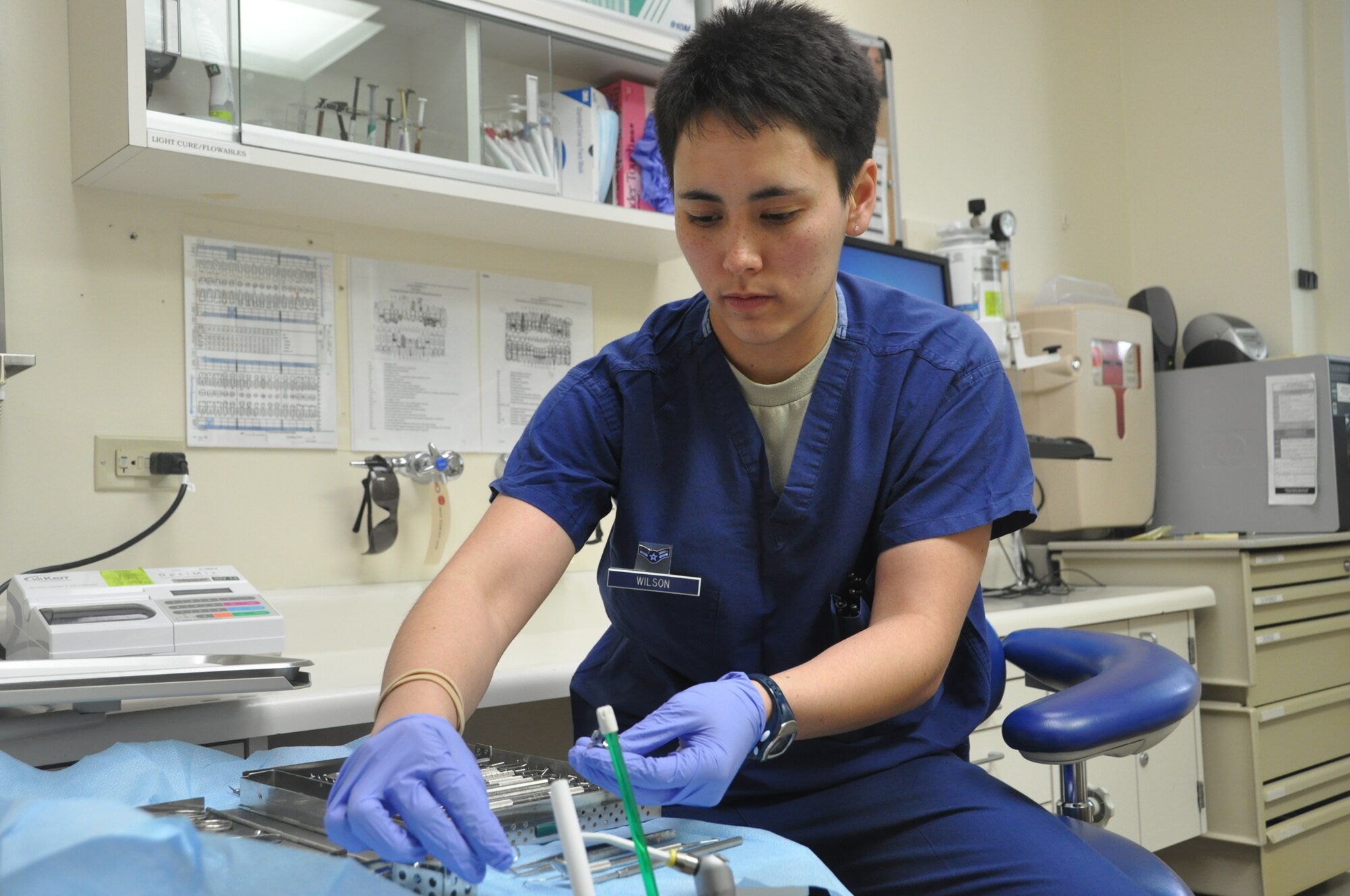 Airman 1st Class Leslie Wilson demonstrates cleaning her tools at the David Grant United States Air Force Medical Center dental clinic earlier this year. Wilson, a lesbian, entered the service after the 2011 repeal of "Don't Ask, Don't Tell." Wilson is a 60th Dental Squadron dental technician. (U.S. Air Force photo/Nick DeCicco) 