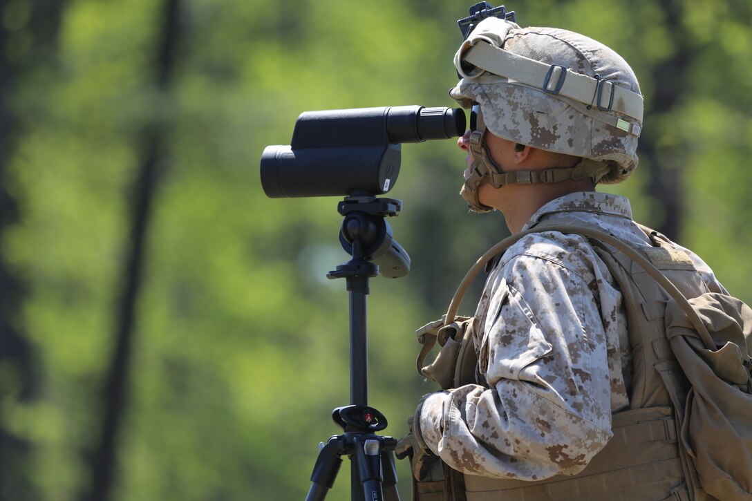 Lance Cpl Kevin Cruzvazquez, a rifleman with Delta Company, 2nd Light Armored Reconnaissance Battalion, 2nd Marine Division, observes rounds impacting on a target during a training evolution aboard Marine Corps Base Camp Lejeune, NC, April 23, 2014. Marines with the battalion received training on the M107 .50 Caliber Special Application Scoped Rifle which included two days of classroom time before practical application on the weapon system the third day. Classes in the training included ballistics, effects of weather on the SASR, range sketches and shooting positions.