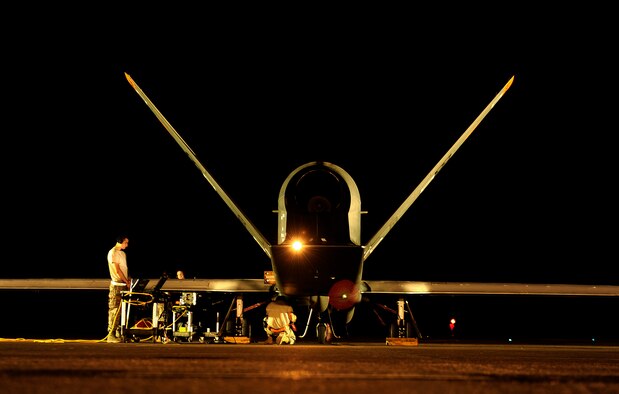 An RQ-4 Global Hawk undergoes pre-flight checks from maintenance technicians before a mission while deployed at an air base in Southwest Asia. Equipped on a block 40 Global Hawk, the Air Force completed the first Maritime Modes program risk reduction flight April 14, 2014. The system is designed to provide intelligence, surveillance and reconnaissance information on vessels traveling on the water's surface. (U.S. Air Force photo/Staff Sgt. Andy M. Kin)