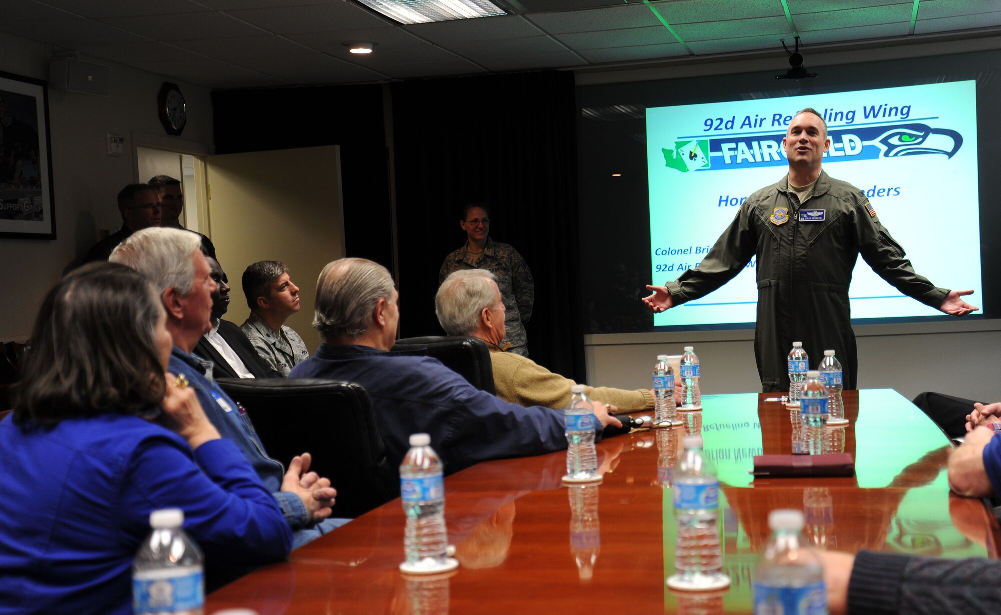 Col. Brian Newberry speaks with Fairchild Honorary Commanders and civic leader program members, also known as Eagles, during a base tour at Fairchild Air Force Base, Wash., April 25, 2014. The groups toured the 92nd Communications Squadron and the 92nd Mission Support Group Emergency Operations Center. Newberry is the 92nd Air Refueling Wing commander. (U.S. Air Force photo by Airman 1st Class Janelle Patiño/Released)
