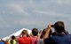 Spectators watch as the U.S. Air Force Thunderbirds perform a diamond formation during the Defenders of Liberty Air Show at Barksdale Air Force Base, La., April 26, 2014. The air show featured several aerial demonstration acts and was headlined by the Thunderbirds. (U.S. Air Force photo/Senior Airman Kristin High)