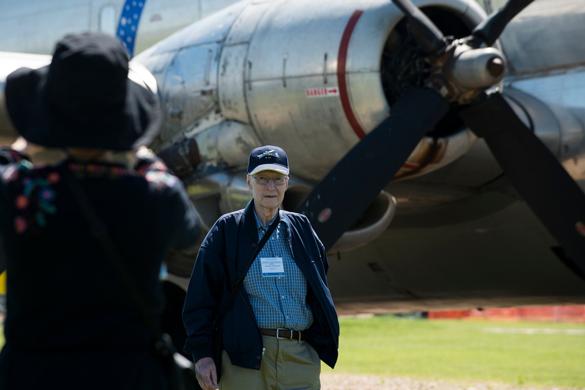 A 307th Bomb Wing Combined Bomber/Tanker Reunion attendee gets his photo taken in front of a KC-97 aircraft on display at the Barksdale Global Power Museum, April 25, 2014, Barksdale Air Force Base, La. Approximately 200 former members of the 307th Bomb Wing attended the reunion and received a tour of the base and the headquarters of the current 307th Bomb Wing. (U.S. Air Force photo by Master Sgt. Greg Steele/Released)