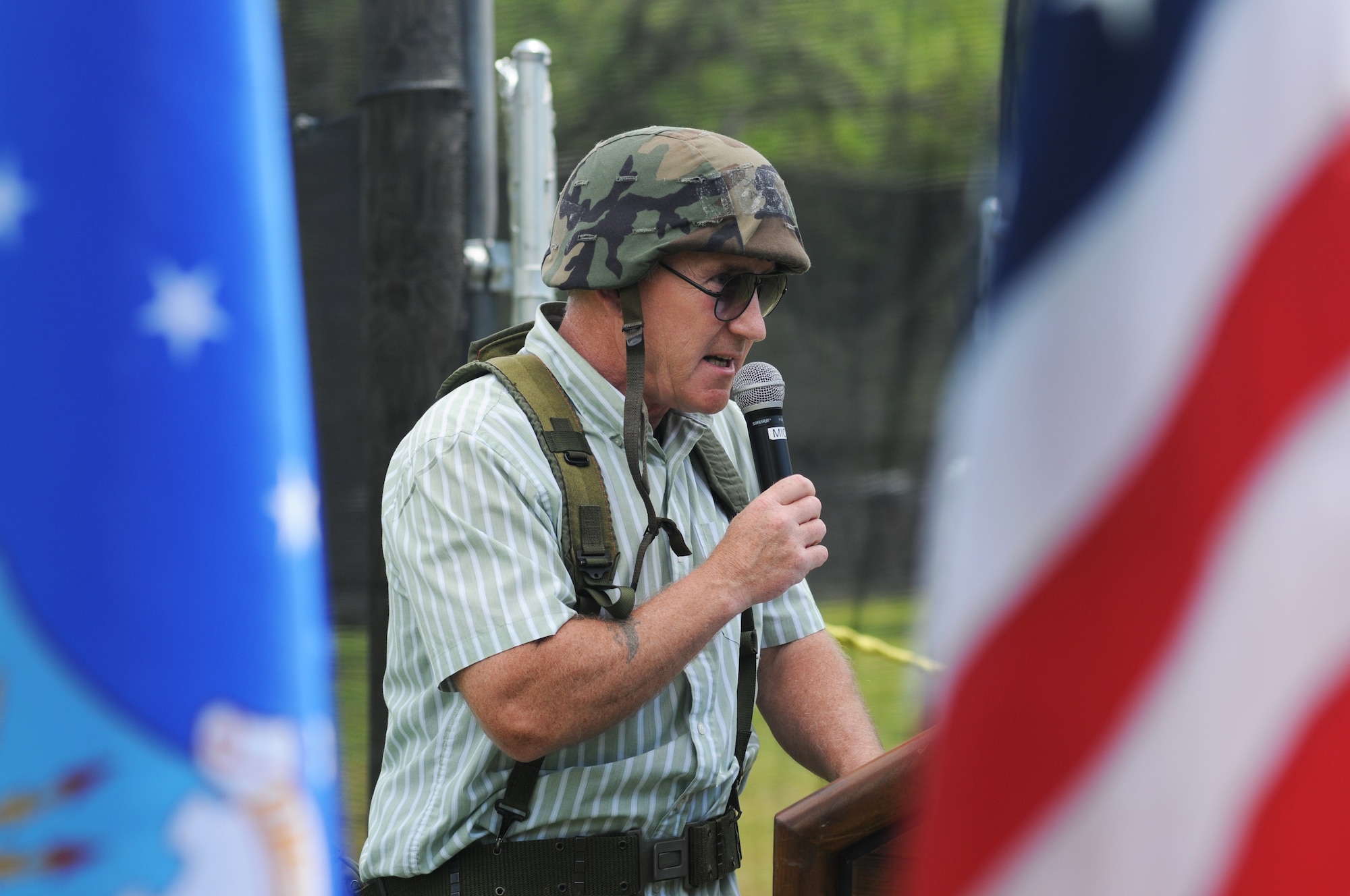 Tom Golden, 81st Force Support Squadron, serves as master of ceremonies, while dressed in combat gear, during the paintball facility grand opening April 25, 2014, southeast of the commissary at Keesler Air Force Base, Miss.  The paintball facility was funded with a portion of the 2013 Commander-in-Chief Installation Excellence award funds.  (U.S. Air Force photo by Kemberly Groue)