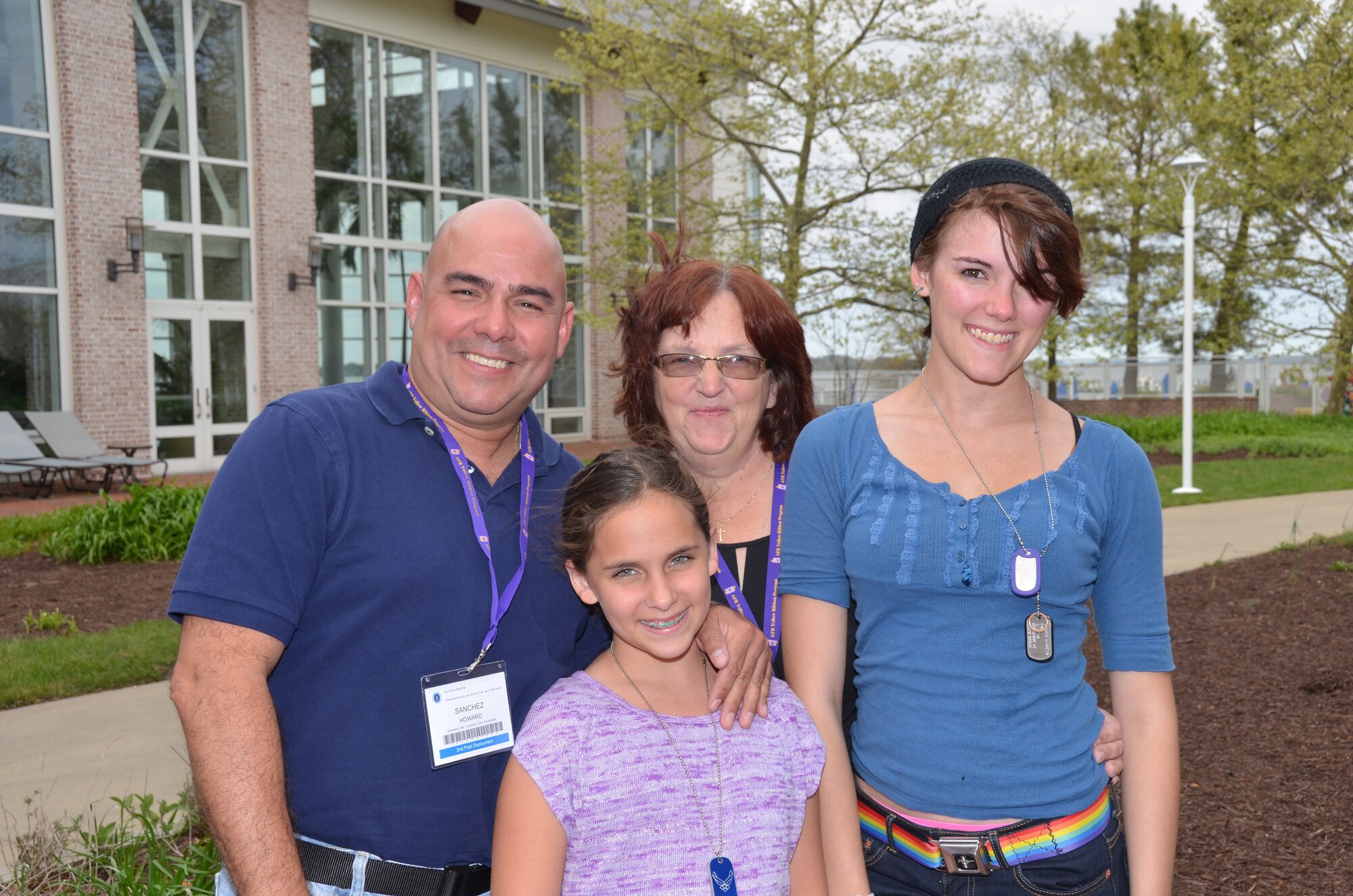 Staff Sgt. Howard Sanchez,482nd Fighter Wing, Homestead Air Reserve Base, Fla., and his family pose for a picture upon arrival at a Yellow Ribbon Reintegration Program event April 25, 2014, in Maryland. Following the reservist's deployment to the Middle East, he and his family attended their second YR event. Reserve and Guard members and their families, like Isabella, 10, Selena, 15 and their mom Carol, can attend a YRRP event before, during and after the servicemember's deployment. (U.S. Air Force photo/Staff Sgt. Kelly Goonan) 