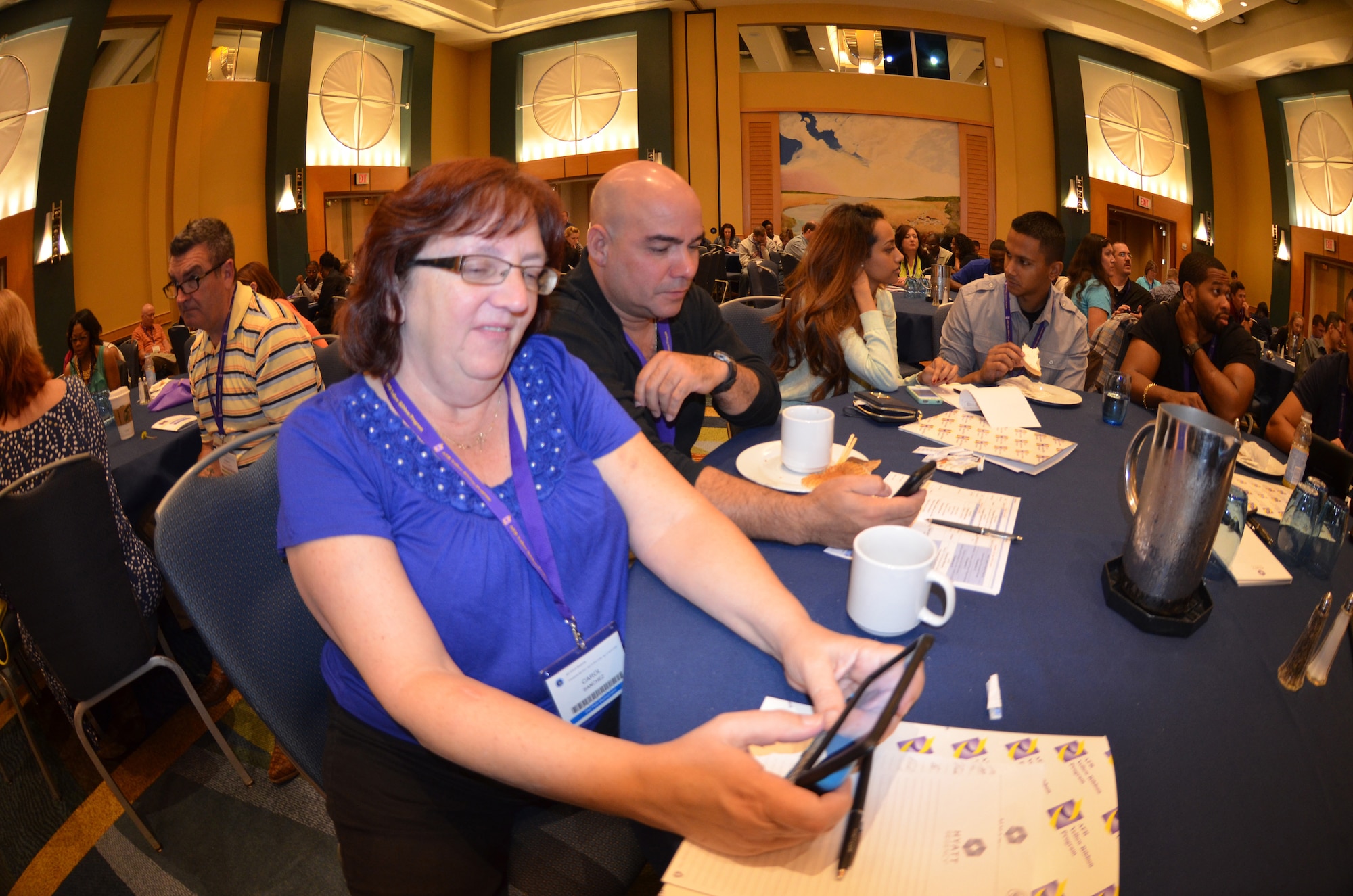 Carol and Staff Sgt. Sanchez, from the 482nd Fighter Wing, Homestead Air Reserve Base, Fla., participate in an electronic quiz at a Yellow Ribbon Reintegration Program event April 26, 2014, in Maryland. The interactive survey was designed to assess how much knowledge YR participants have on various military benefits and services prior to the start of the two-day event. (U.S. Air Force photo/Staff Sgt. Kelly Goonan)  