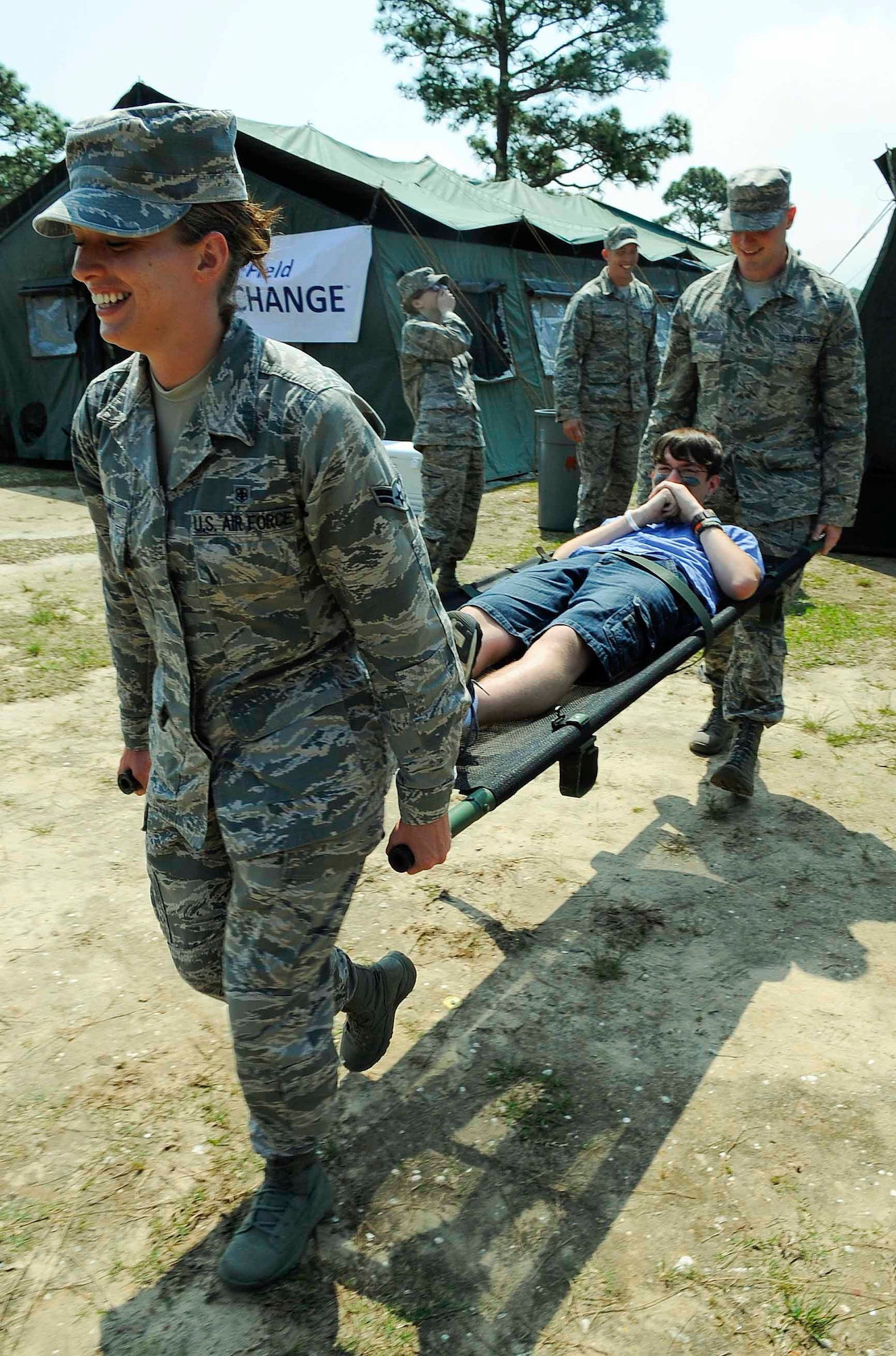 Airman 1st Class Susan Janks and Airman 1st Class Jonathon Broy, 1st Special Operations Aerospace Medical Squadron public health technicians, carry Ethan Holt at Hurlburt Field, Fla., April 26, 2014. Holt was evacuated out of a “deployed environment” after being "injured." (U.S. Air Force photo/Airman 1st Class Andrea Posey)