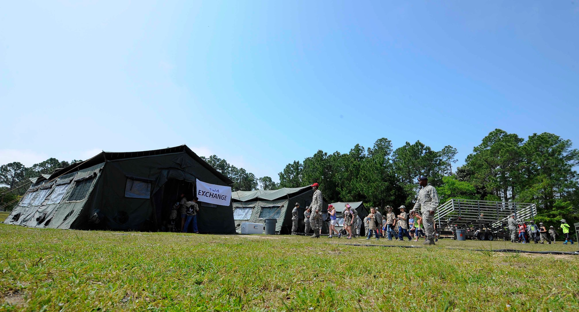Military children explore Camp RED HORSE, a simulated deployment camp, at Hurlburt Field, Fla., April 26, 2014. Military children participated in Kids Understanding Deployment Operations to see what their parents go through during deployments. (U.S. Air Force photo/Airman 1st Class Andrea Posey)