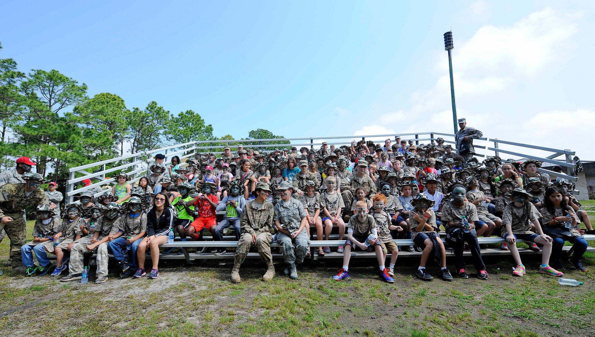 Kids Understanding Deployment Operations councilors and participants show their warrior faces at Hurlburt Field, Fla., April 26, 2014. Military children participated in KUDOS to see what their parents go through during deployments. (U.S. Air Force photo/Airman 1st Class Andrea Posey)