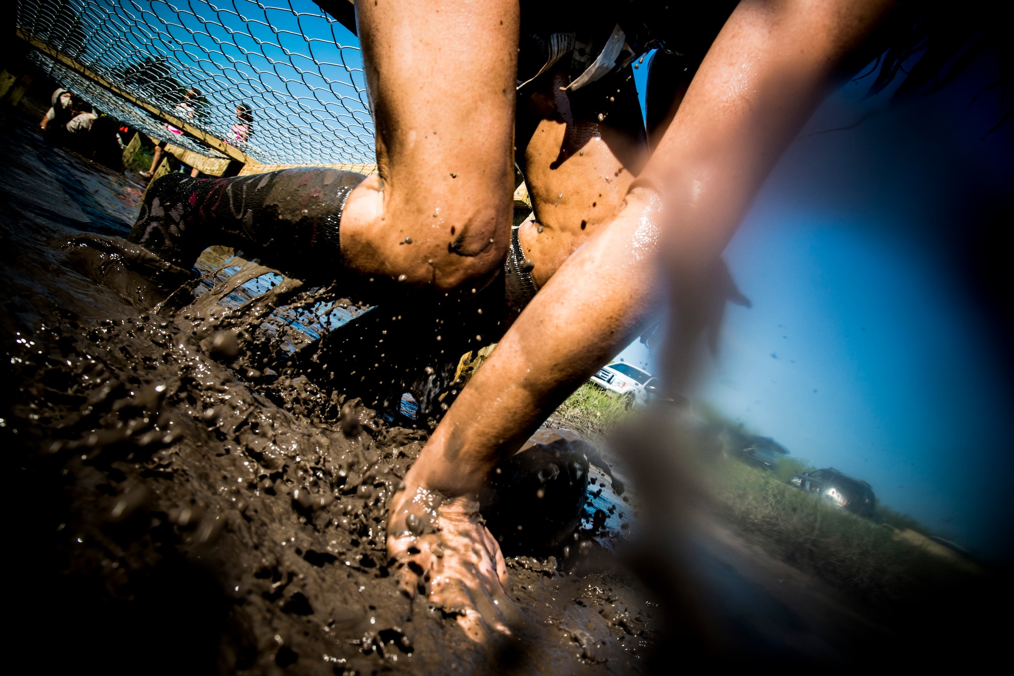 Sabrina Neely makes her way through an obstacle during the Moody Mudder run April 26, 2014, in Ray City, Ga. The event, which was in its first iteration, was open to all of Team Moody as well as the local community. (U.S. Air Force photo by Staff Sgt. Jamal D. Sutter/Released) 
