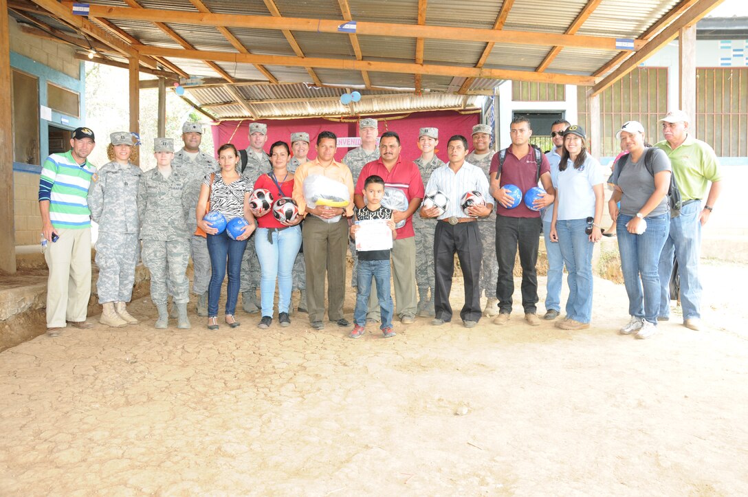 Joint Task Force-Bravo service members present soccer balls and shirts that were donated by the Kick for Nick Foundation to the community during a Medical Readiness Training Exercise in El Naranjo, a remote village in the La Paz region of Honduras, April 24-25.  The Medical Element, with support from JTF-Bravo Joint Security Forces, partnered with the Honduran Ministry of Health, the Honduran National Police, and the Honduran military to provide medical care to nearly 1,000 people over a two day period.  The teams worked together to provide preventive medicine to their patients which included classes on hygiene, hand washing, preventive dental care, and nutrition.  They also provided immunizations to infants, dental care, well women screenings, wellness checkups, medications, and minor medical procedures.  (Photo by U. S. Air National Guard Capt. Steven Stubbs)