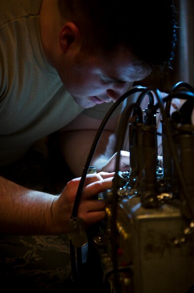 Senior Airman Nathanial Rega, 91st Missile Maintenance Squadron electro-mechanical team maintenance technician, works with the electrical power test set during distribution box during training at Minot Air Force Base, N.D., April 09, 2014. The 91st Maintenance Group is the maintenance backbone of the 91st Missile Wing. The group was originally activated as the 91st Maintenance and Supply Group on November 10, 1948. Today, the group is responsible for providing maintenance and logistics support for the wing's ICBM fleet. (U.S. Air Force photo/Senior Airman Brittany Y. Auld)
