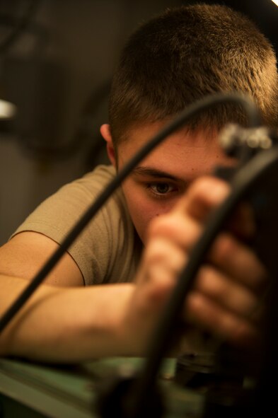 Airman 1st Class Maxwell Clement, 91st Missile Maintenance Squadron electro-mechanical team maintenance technician, connects a cord from the distribution box during training at Minot Air Force Base, N.D., April 09, 2014. The 91st Maintenance Group is responsible for providing maintenance and logistics support for the wing's ICBM fleet. (U.S. Air Force photo/Senior Airman Brittany Y. Auld)