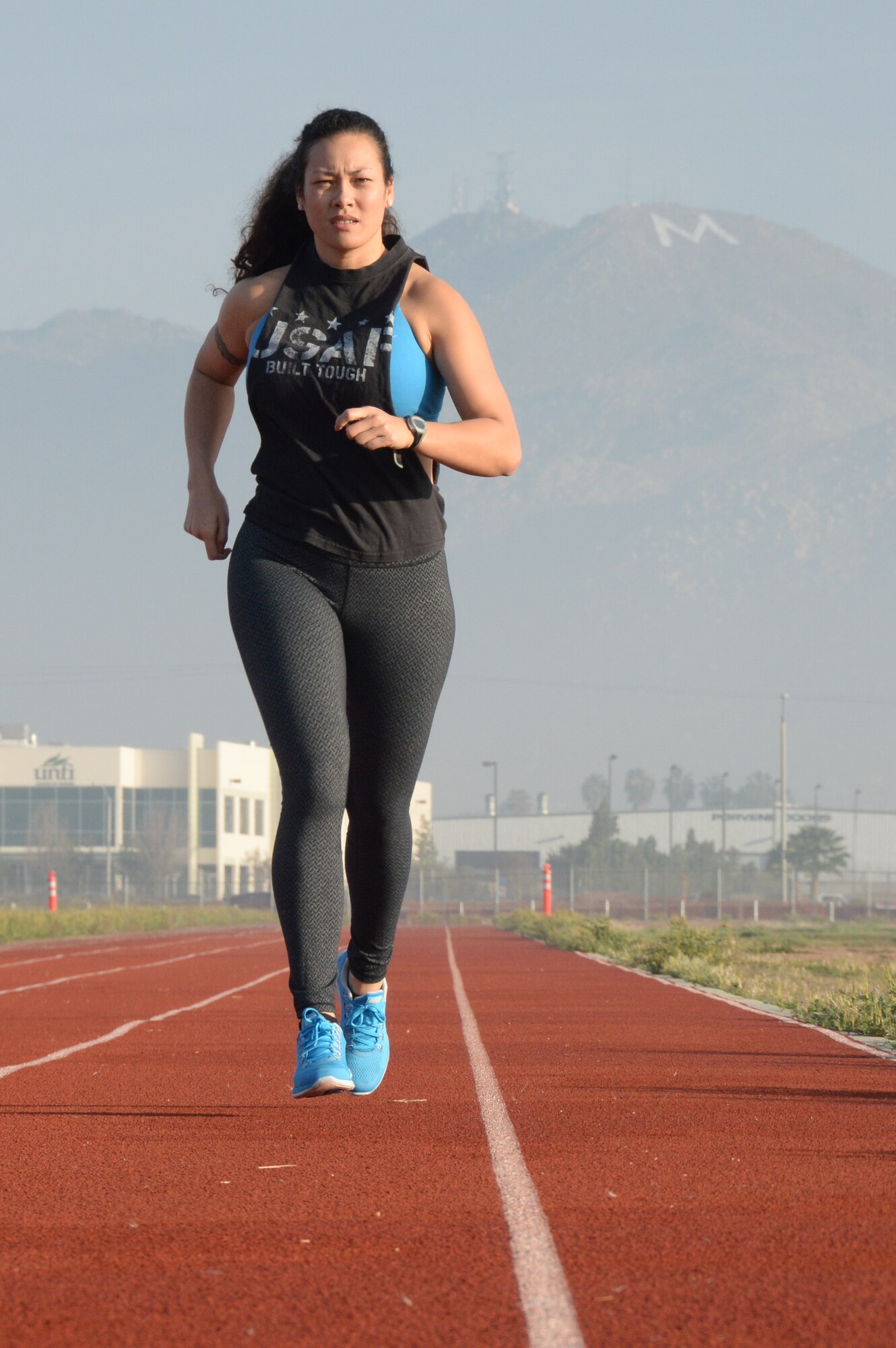 Senior Airman Coral Williams, 163rd Comptroller Flight, begins a run on the
March Air Reserve Base track, April 7. Running is one of the many cardiovascular
exercises Williams participates in to stay in shape. She has made exercise a habit
in her life, constantly seeking new challenges, goals and motivation.  (U.S. Air Force photo/Tech Sgt. Neil Ballecer)