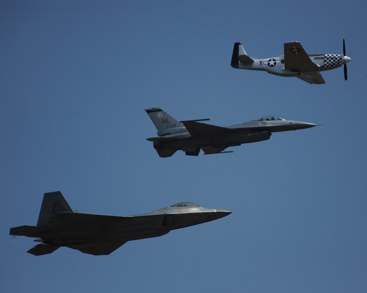 (From top to bottom) A P-51 Mustang, F-16 Fighting Falcon and F-22 Raptor take part in a Heritage Flight during the 2014 Defenders of Liberty Air Show on Barksdale Air Force Base, La., April 26. The flight displays U.S. Air Force airpower history and also honors the brave men and women who have served, or are currently serving in the Air Force. (U.S. Air Force photo/Staff Sgt. Sean Martin)