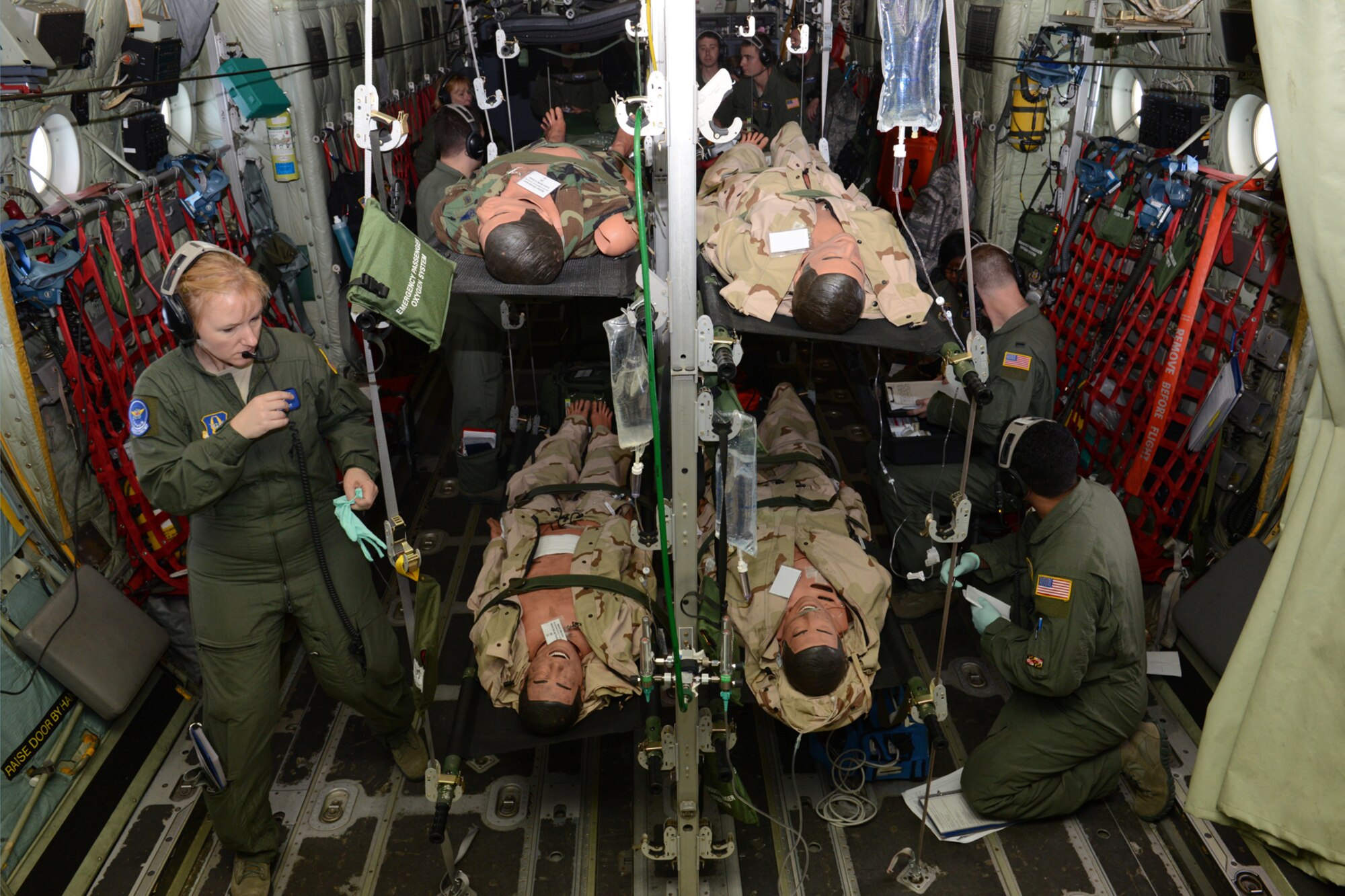 Students and instructors from an aeromedical evacuation class at Pope Field, N.C ., check to see that equipment and simulated patients are secure for takeoff on a 53rd Weather Reconnaissance Squadron WC-130J during an aeromedical evacuation class here April 26, 2014. Aircrew members from the 53rd WRS “Hurricane Hunters,” Keesler Air Force Base, Miss., participated in an aeromedical evacuation training exercise April 26-27 at Pope Field designed to teach students how to handle medical situations that might arise while transporting patients to their destination. (U.S. Air Force photo/Tech. Sgt. Ryan Labadens)