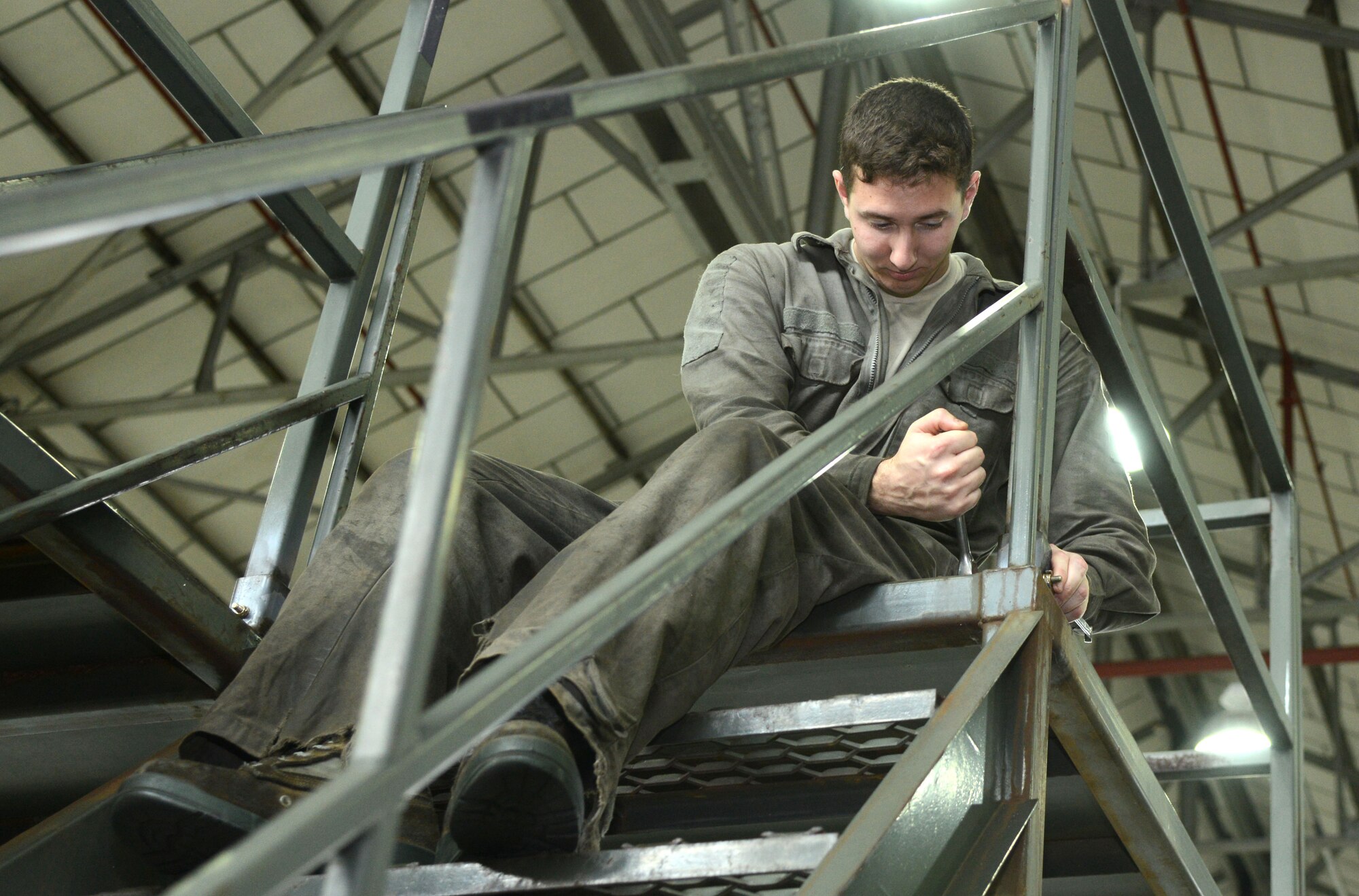 U.S. Air Force Airman 1st Class Christopher Secoy, 100th Maintenance Squadron Aerospace Ground Equipment apprentice from Gardener, La., adjusts a screw on a stand April 23, 2014, on RAF Mildenhall, England. The AGE shop works on the ground equipment the aircrew uses on the flightline. (U.S. Air Force photo by Airman 1st Class Kelsey Waters/Released)
