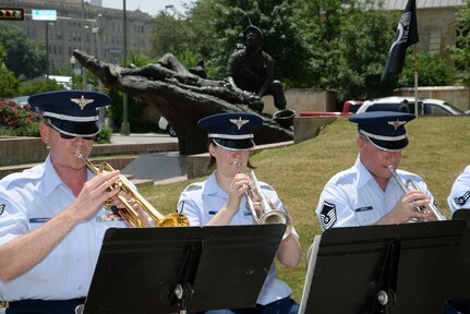 The United States Air Force Band of the West plays patriotic music April 27 during the Fiesta 2014 All Veterans Memorial Service in Veterans Square, San Antonio.  Vietnam Veterans of America Alamo Chapter 366 holds the solemn annual event to honor past and present U.S. military members’ service to protect American freedom. Since Fiesta’s beginning in 1891 to honor the heroes of the Alamo and the Battle of San Jacinto, it has evolved into one of the nation’s premier festivals with civic and military observances, street and river float parades, exhibits, sports, music and food representing the history, spirit, diversity and vitality of San Antonio. (U.S. Air Force photo by Johnny Saldivar)